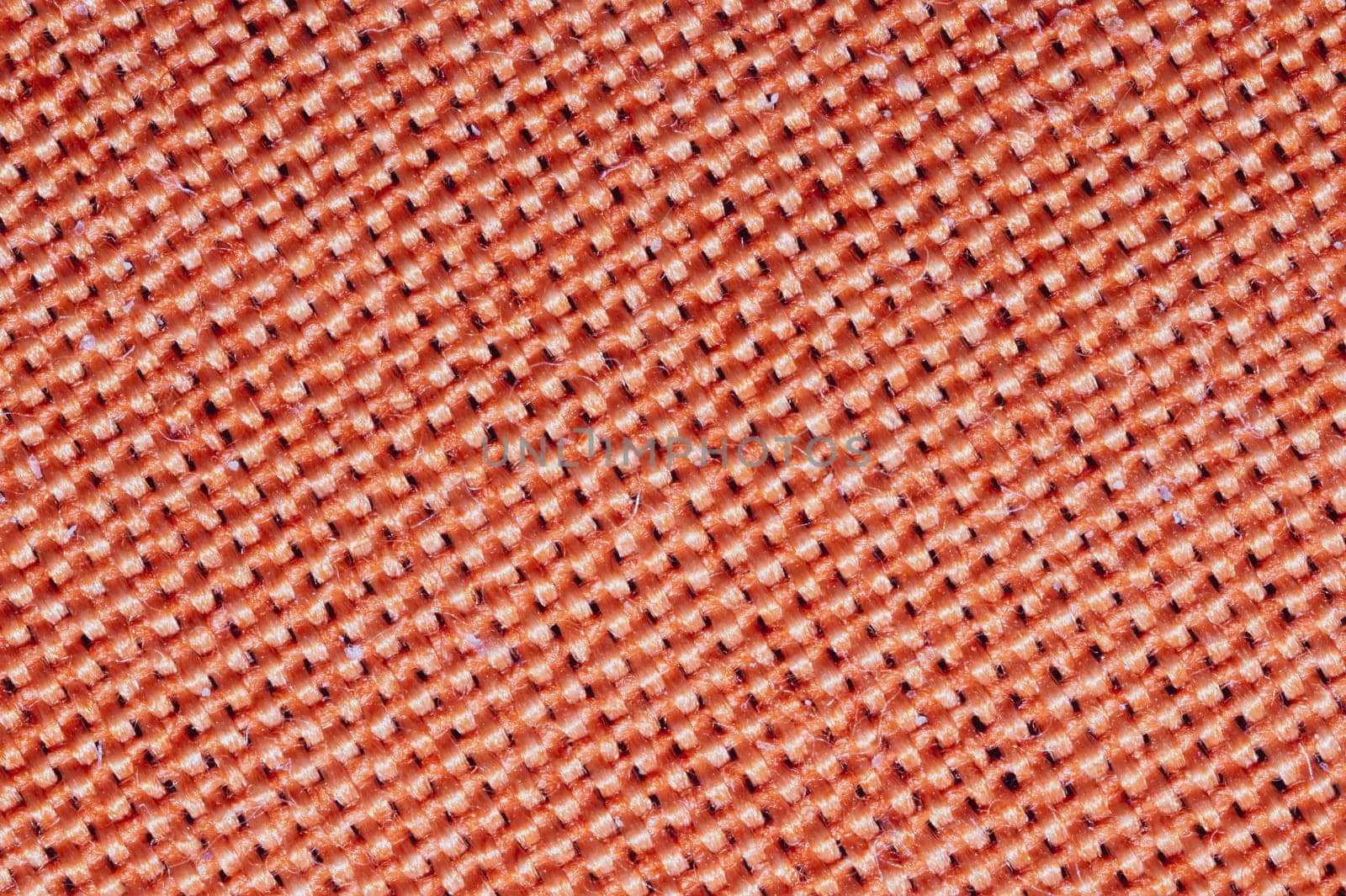 Orange fabric texture. knitted textile background. woven material macro