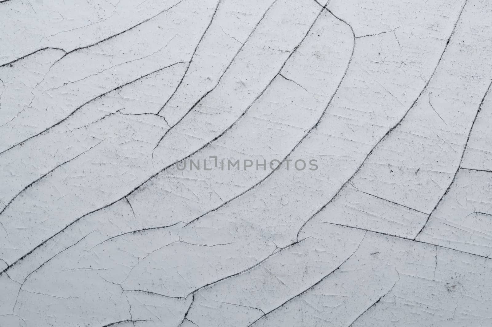 Cracked paint on a wooden surface. grunge texture with peeling paint on wood