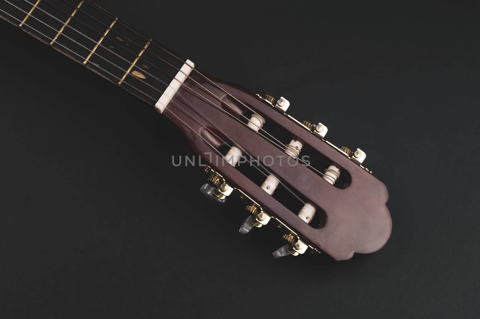 Guitar fretboard close up. musical instrument. strings on the guitar neck. copy space