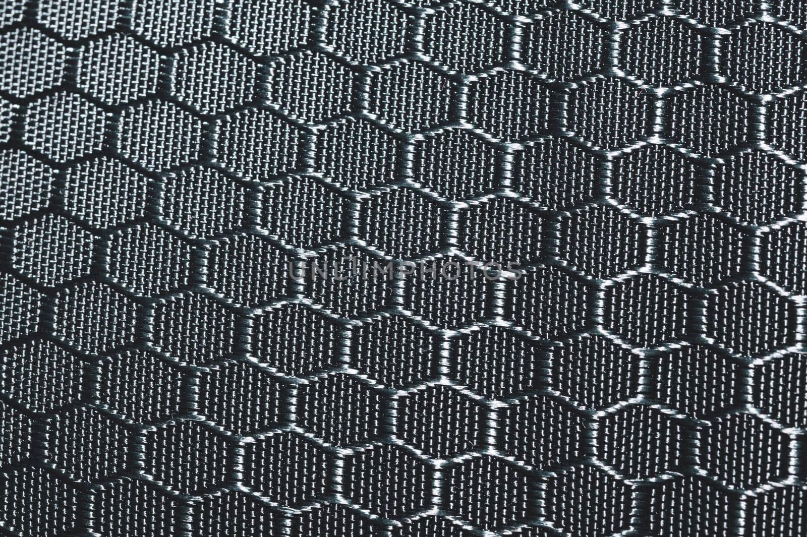 Fabric texture with hex shaped cells. textile background. woven material