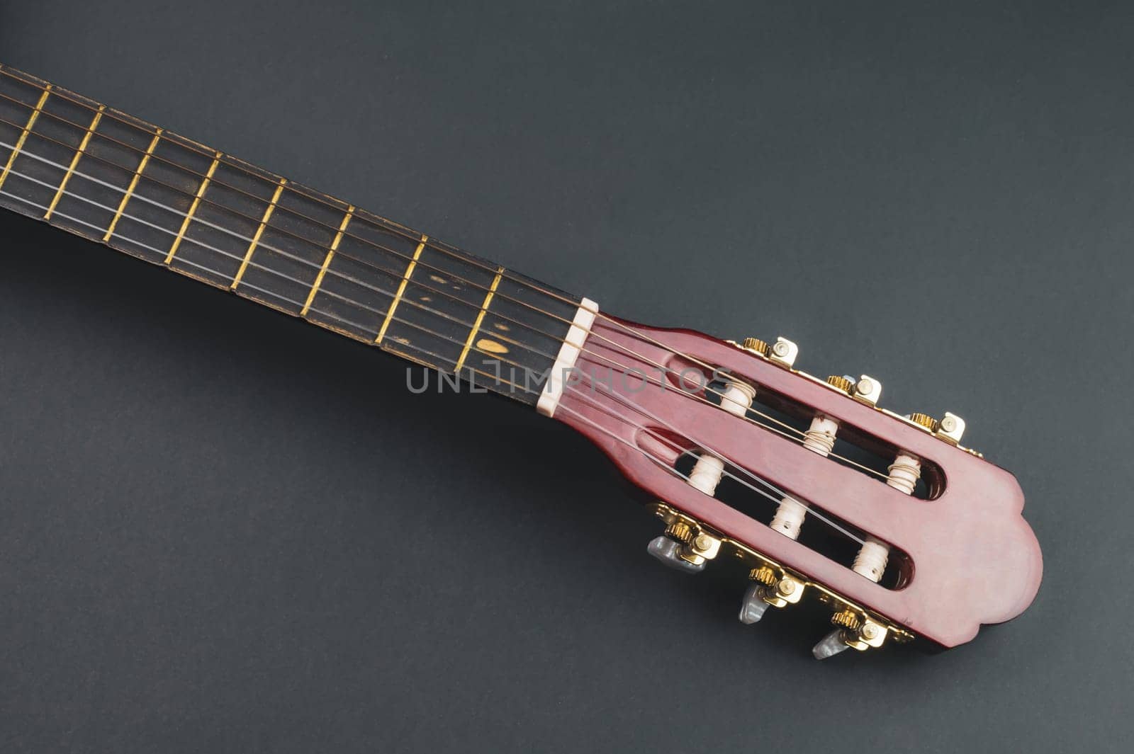 Guitar fretboard close up. musical instrument. strings on the guitar neck. copy space