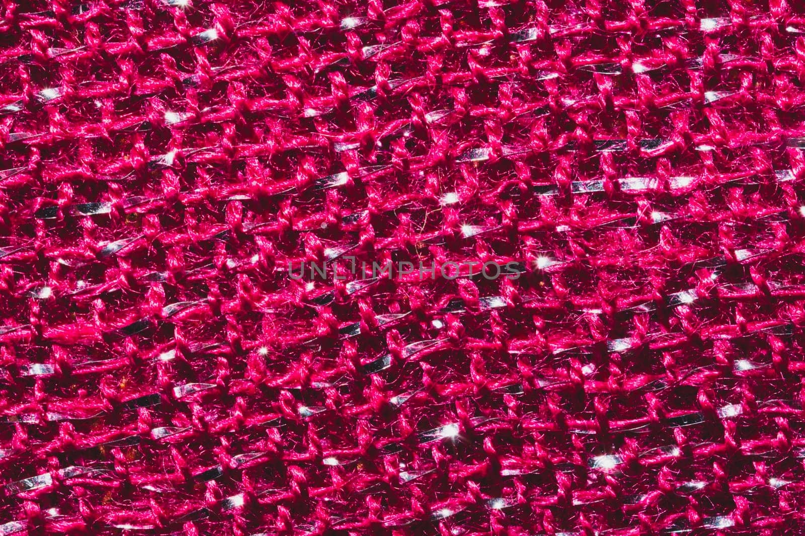 Red fabric texture. knitted textile background. woven material close up