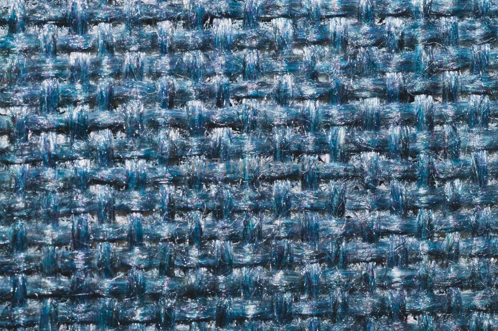 Blue fabric texture. knitted textile background. woven material macro