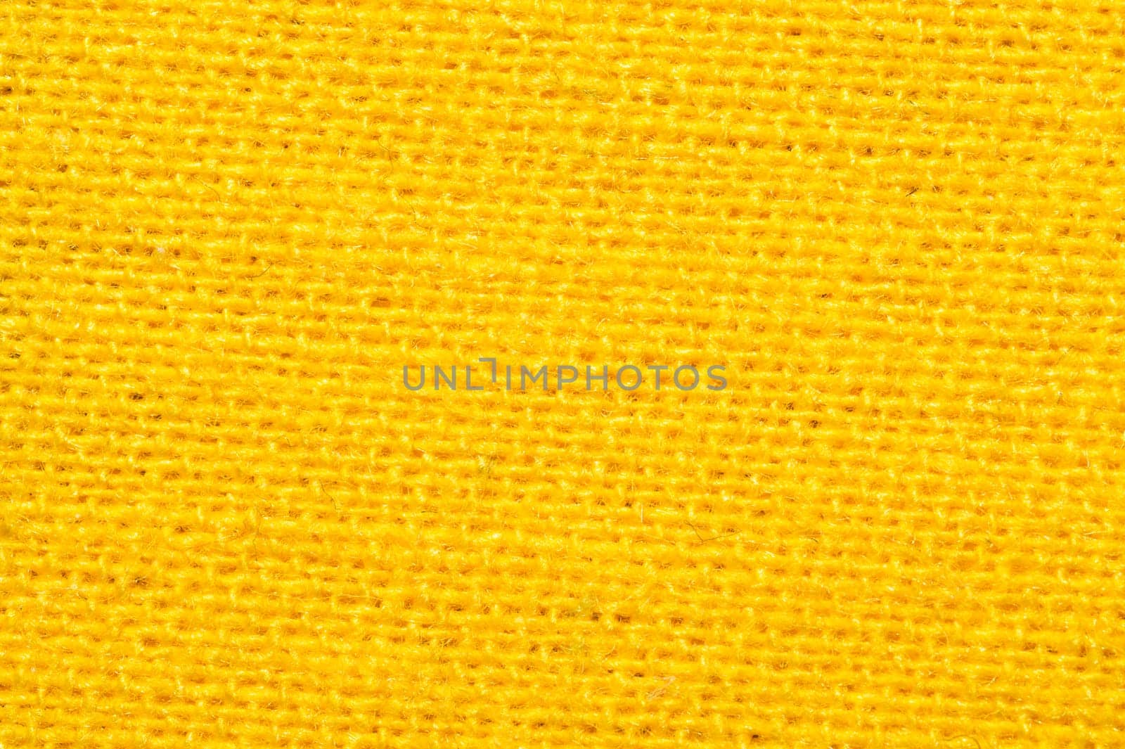 Yellow textile close up. knitted fabric texture. woven material background