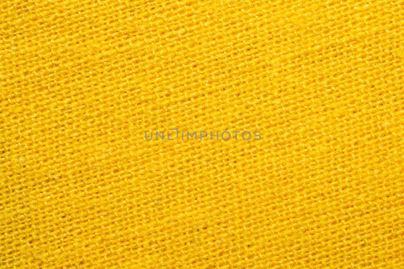 Yellow textile close up. knitted fabric texture. woven material background