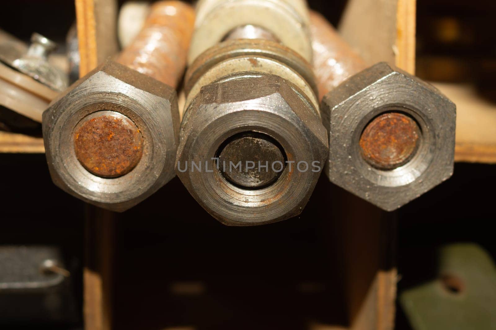 Old screws in a box. a lot of various screws. pile of fasteners in the box close up. carpentry workshop. work tool