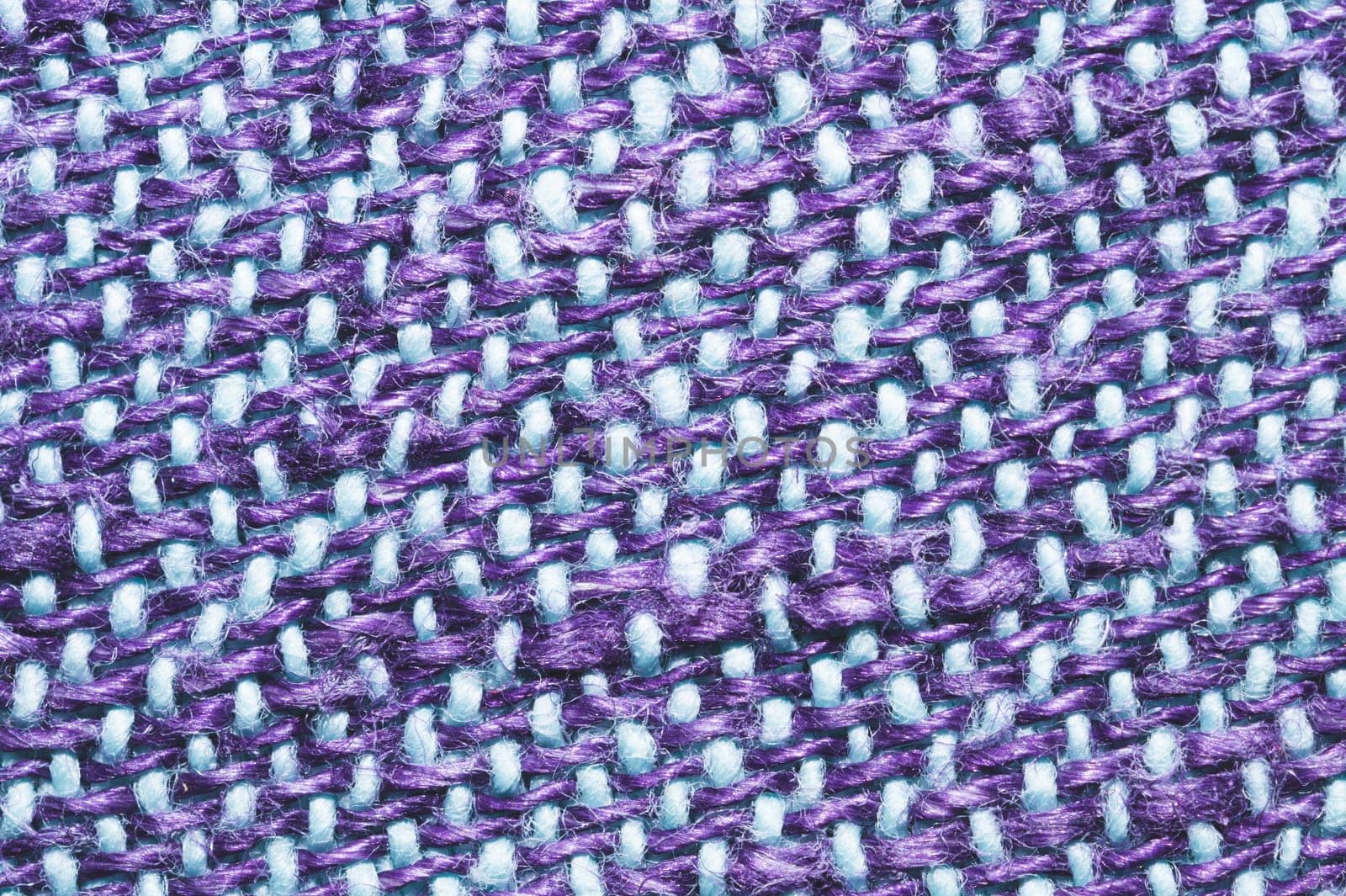 Fabric macro texture. knitted material close up. woven background. woolen textile