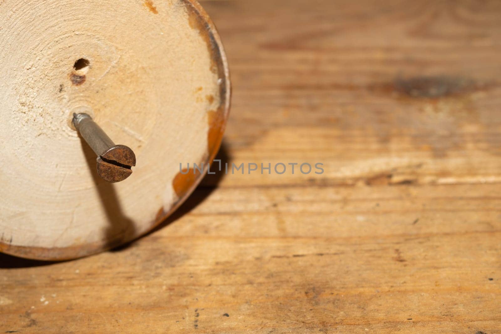 Old screw in wood close up. carpentry work background