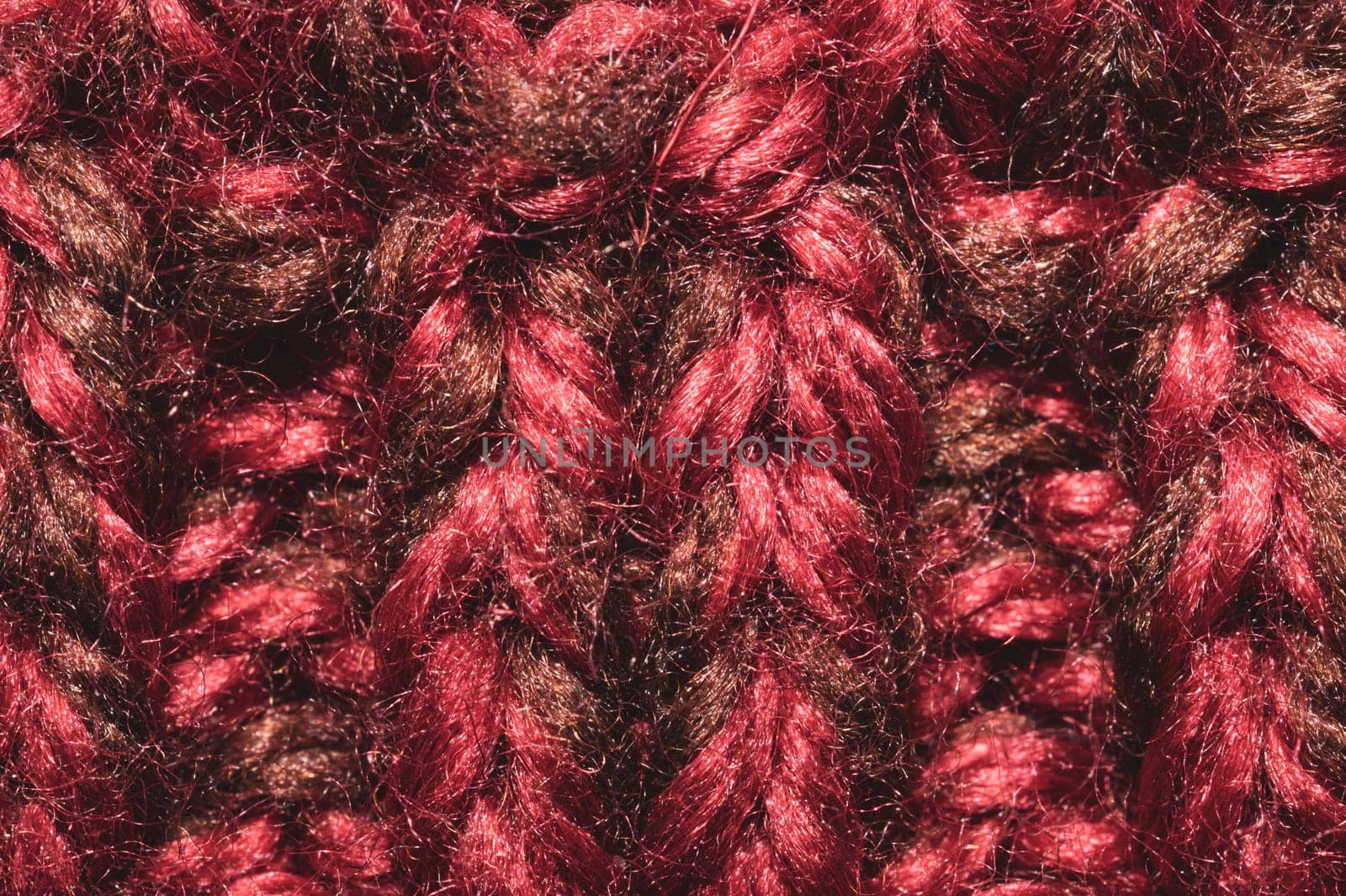 Knitted wool texture. fabric material close up. red textile background