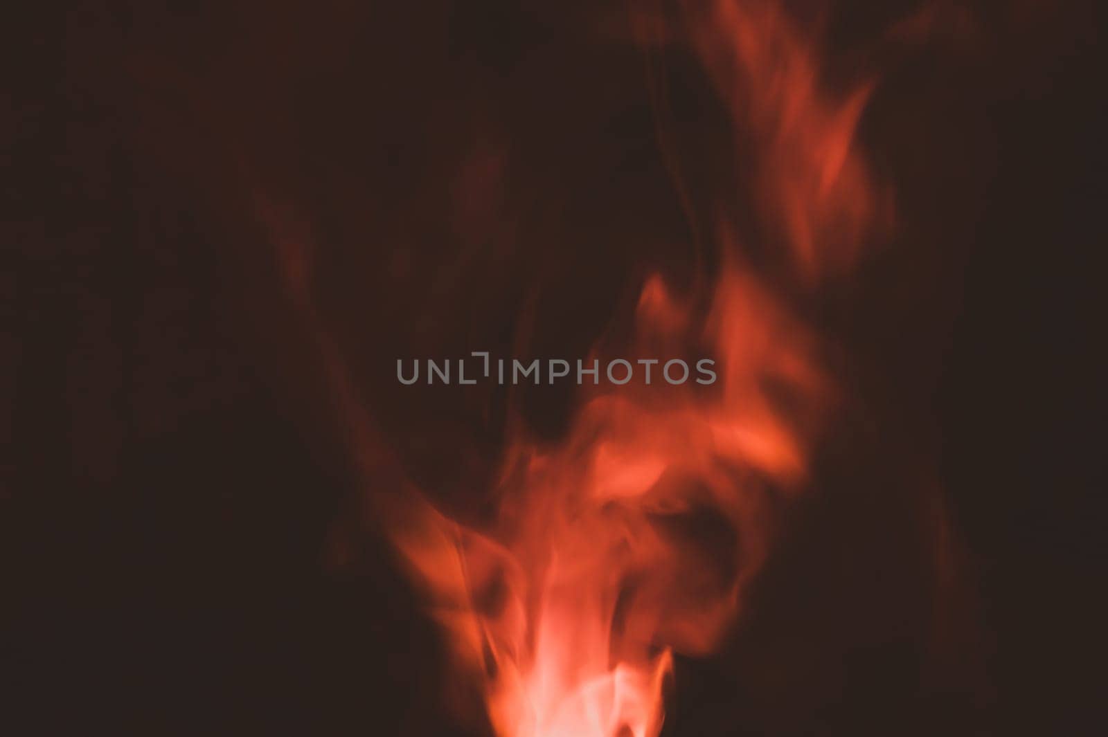 Colored smoke on black backdrop. brown fog abstract background
