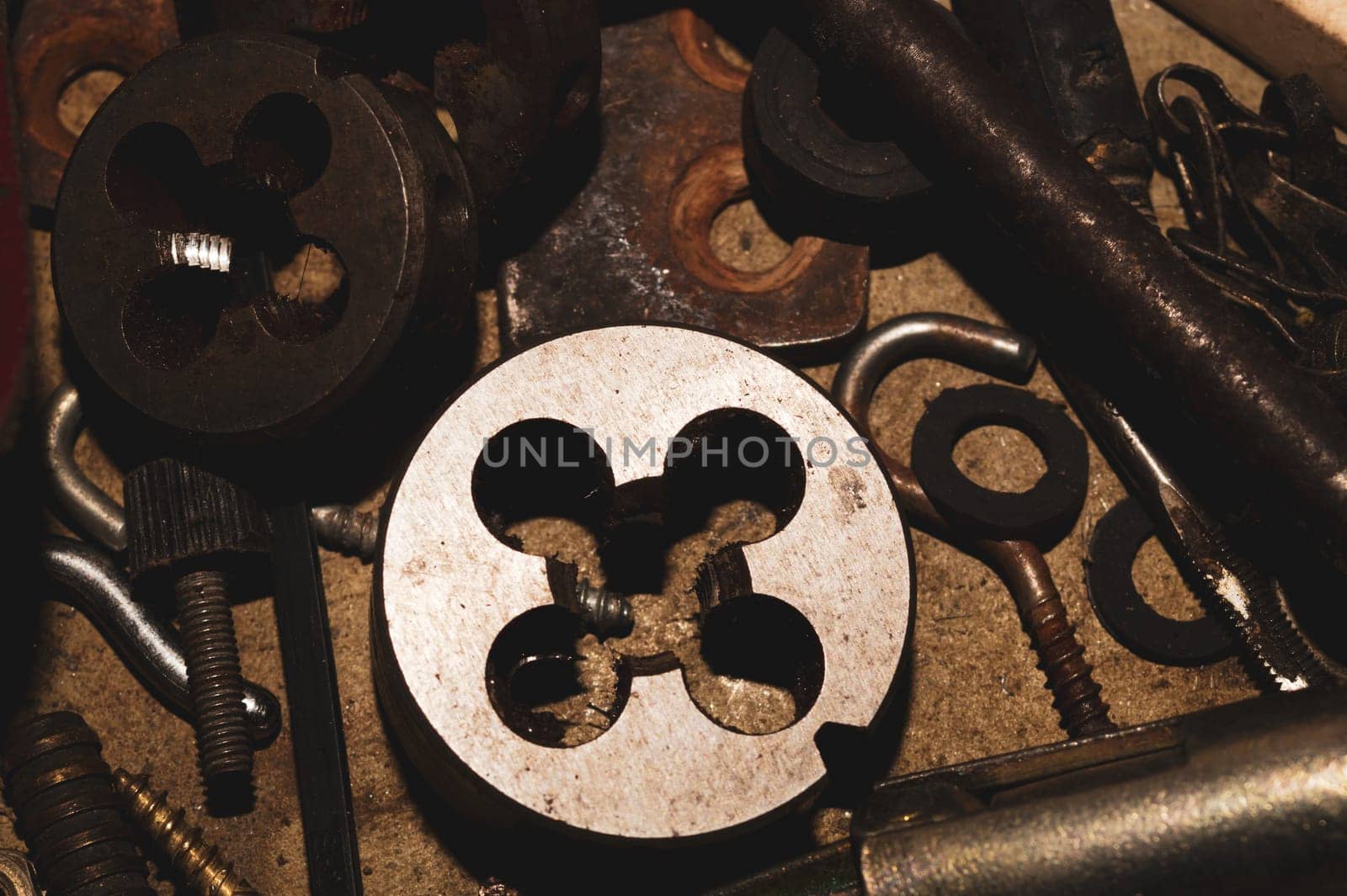 Pile of fasteners and screws close up. scrap metal. different metal parts