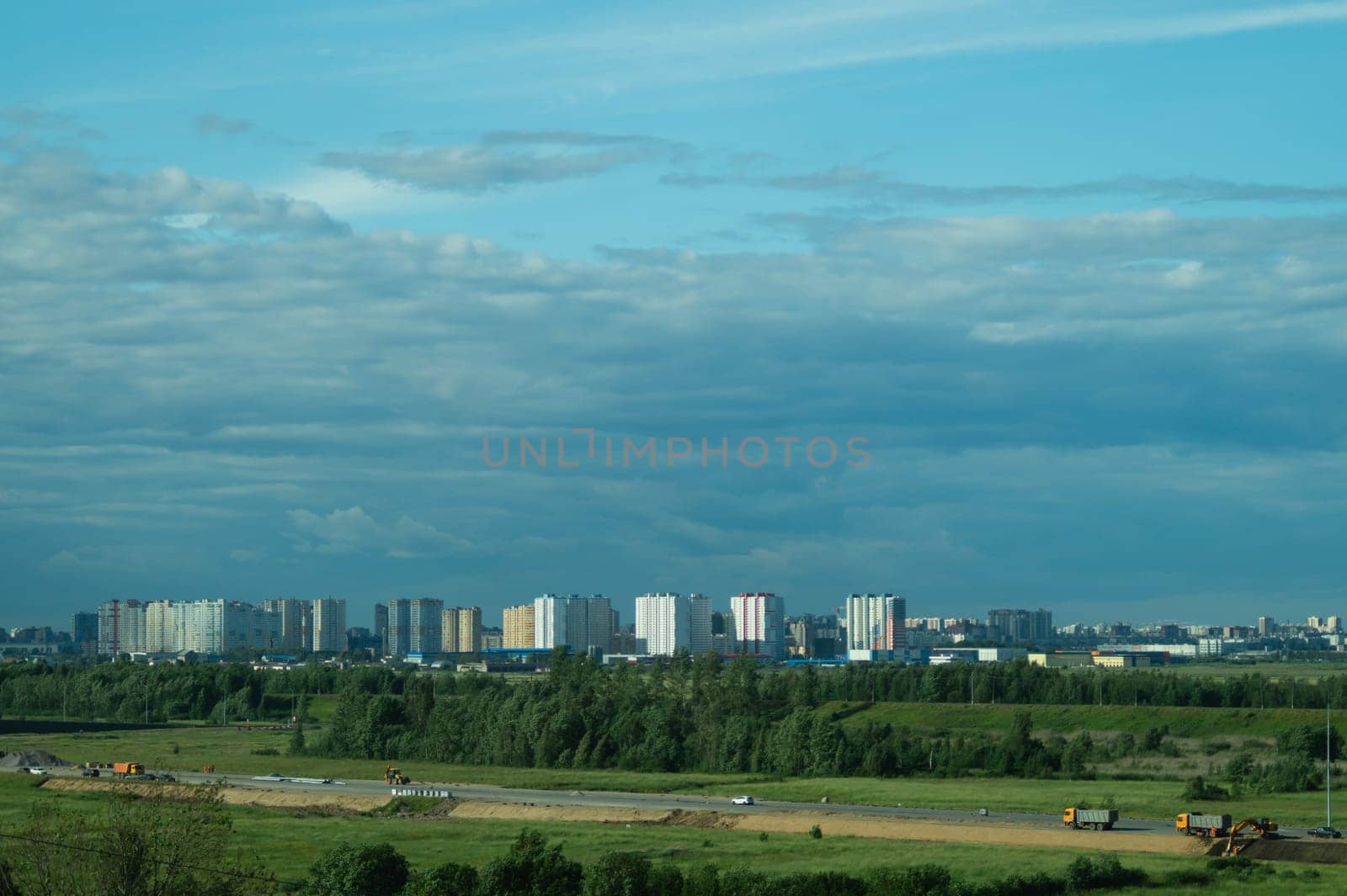 Urban cityscape panoramic view. horizon line with buildings. nature landscape with town and forest. blue sky. city into a distance