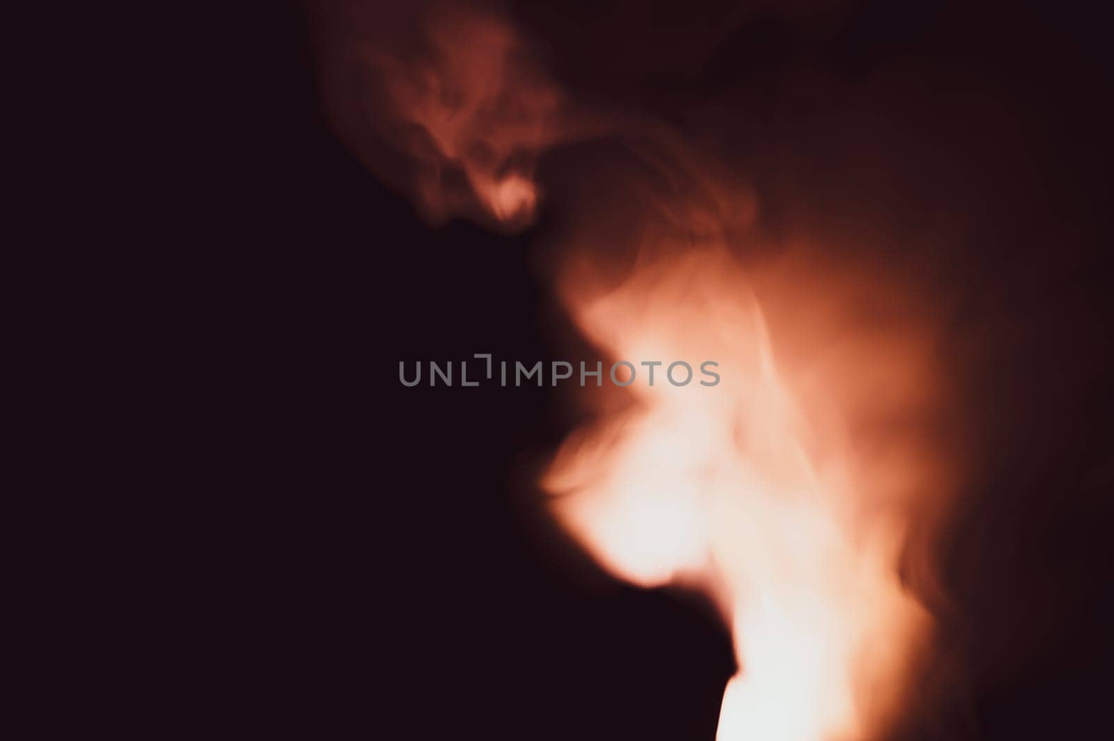 Colored smoke on black backdrop. brown fog abstract background