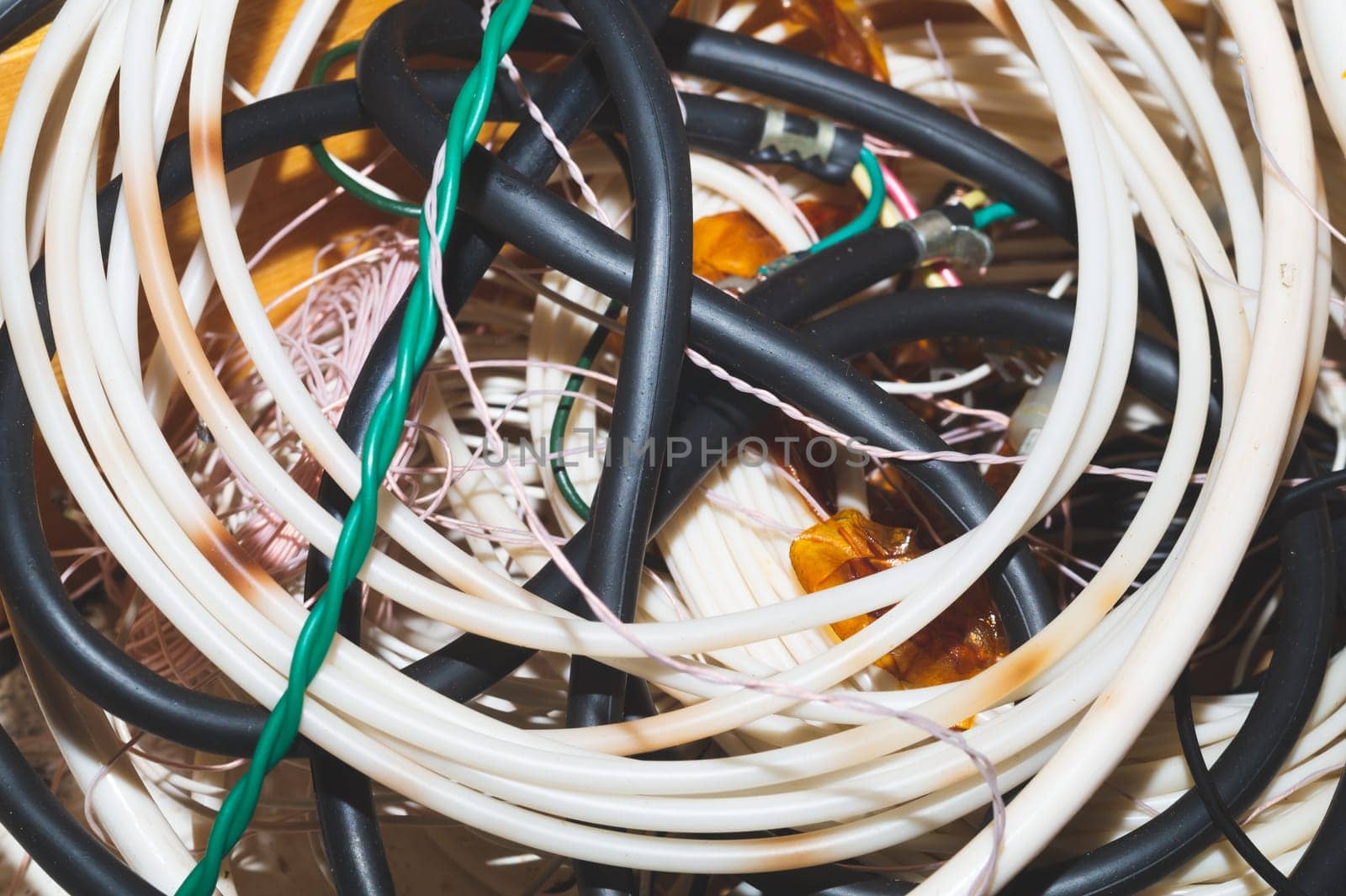 Old hoses and wires close up. twisted hosepipe. gardening equipment