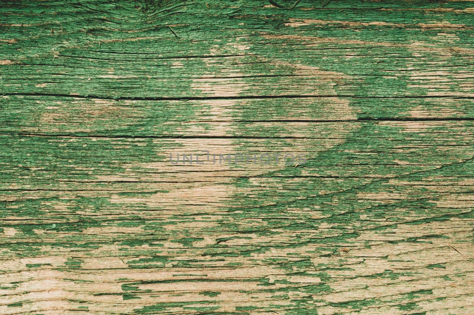 Abstract wood texture with peeling paint. green wooden backdrop. shabby painted wood background