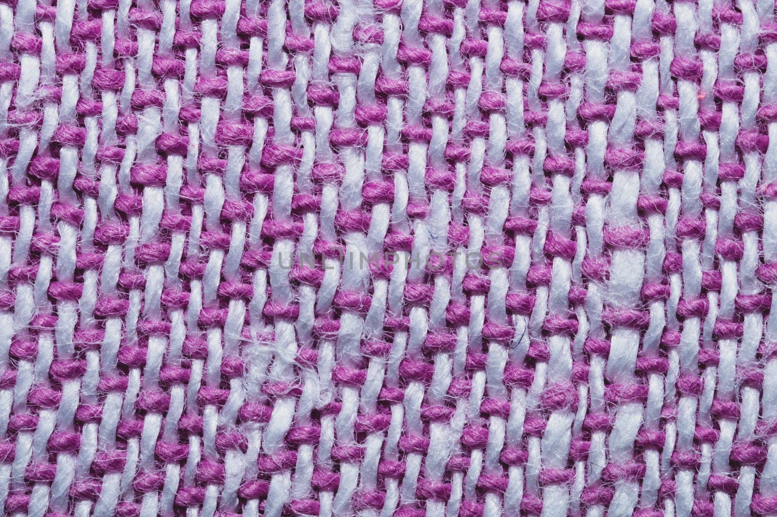 Pink fabric texture. knitted textile background. woven material close up