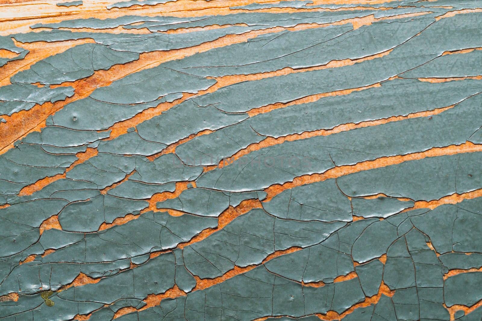 Rough wood texture with peeling paint. old wooden texture with cracked paint close up