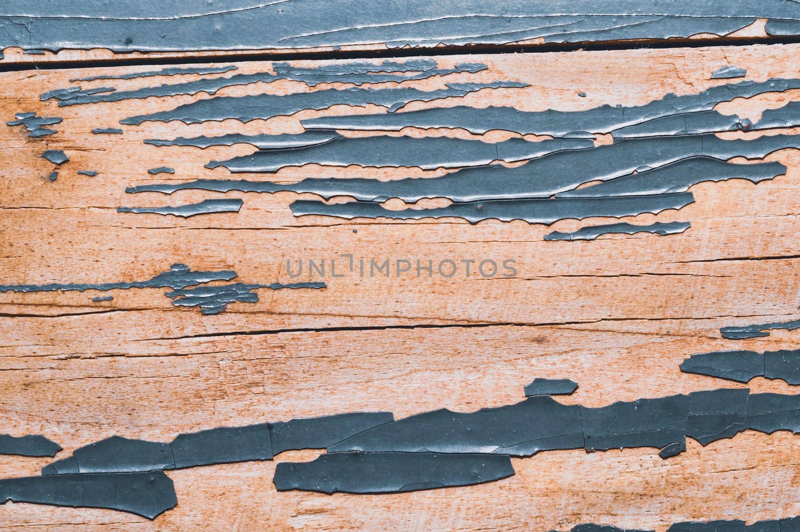 Rough wood texture with peeling paint. old wooden texture with cracked paint close up
