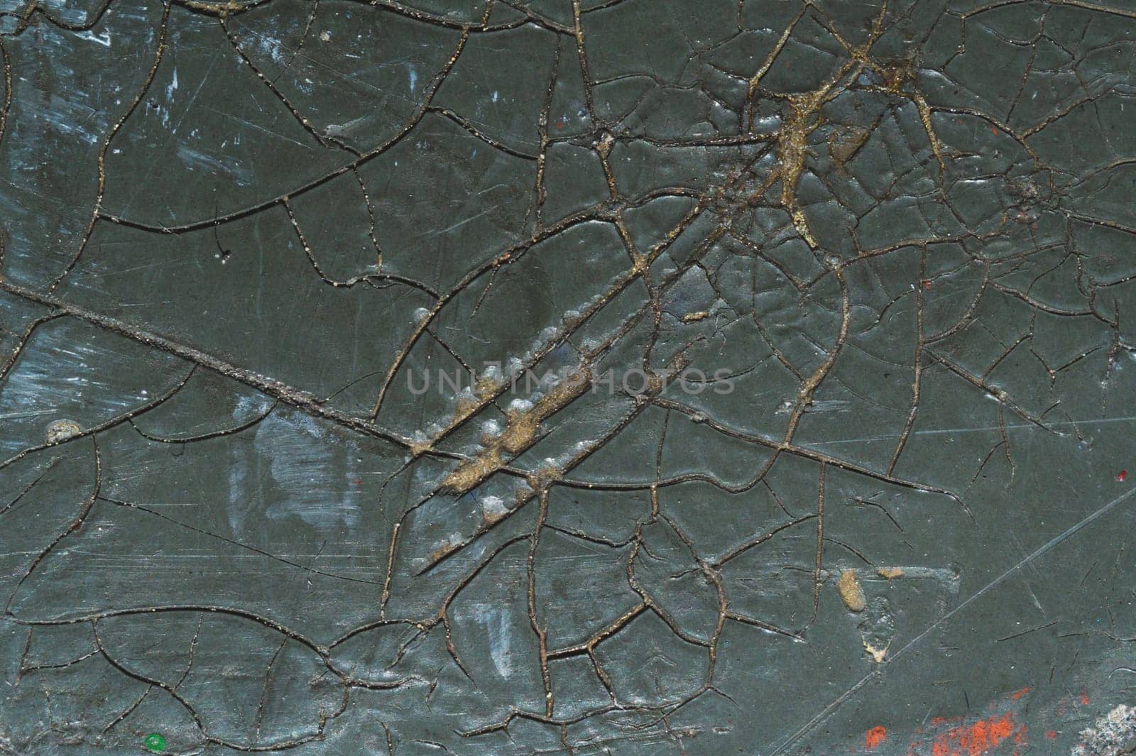 Cracked black coating on wooden surface. grunge background. wood texture with shabby paint. spots and scratches