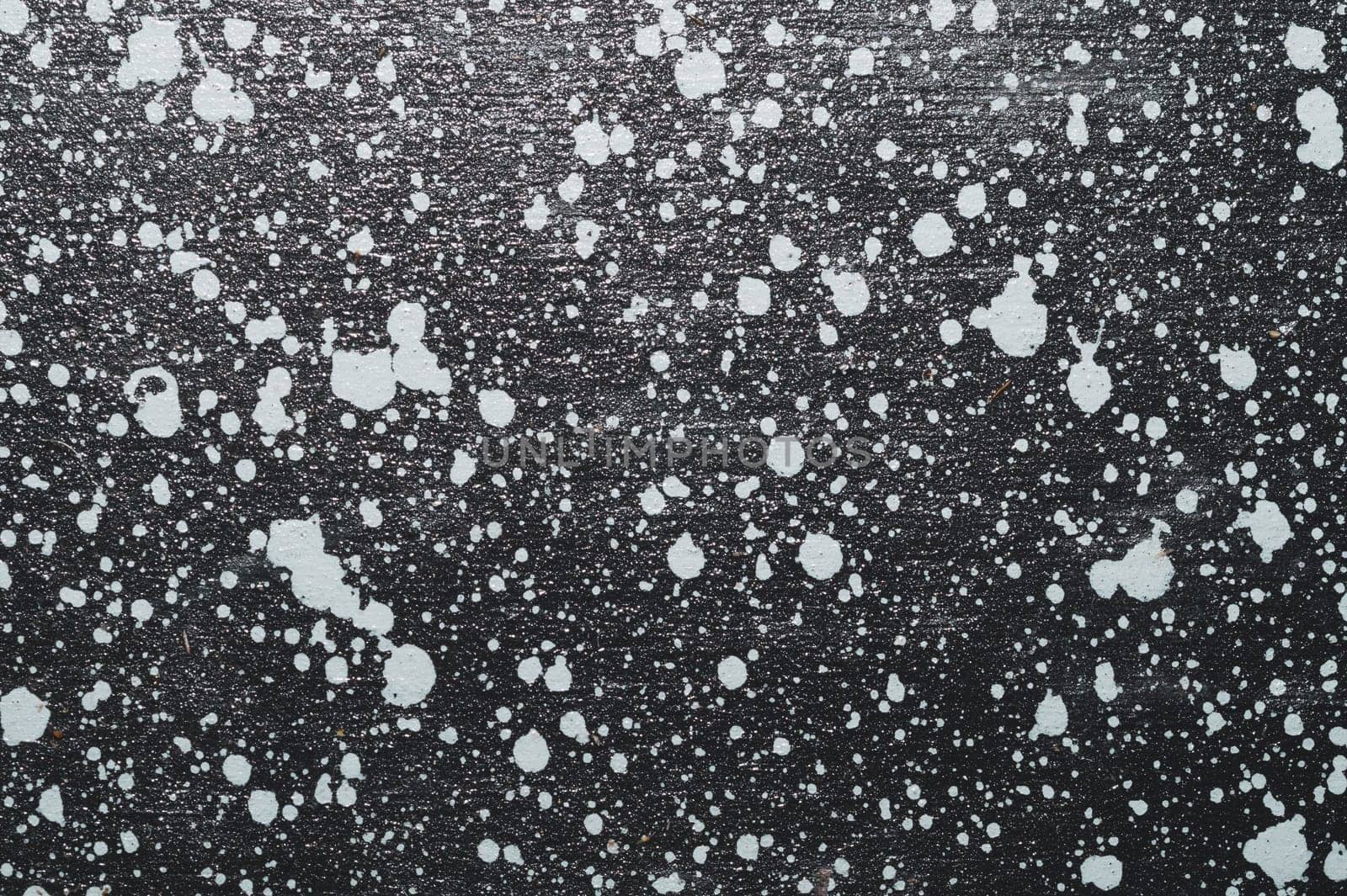 Painted wood surface with spots. wooden background with paint splashes. grunge texture with stains and scratches