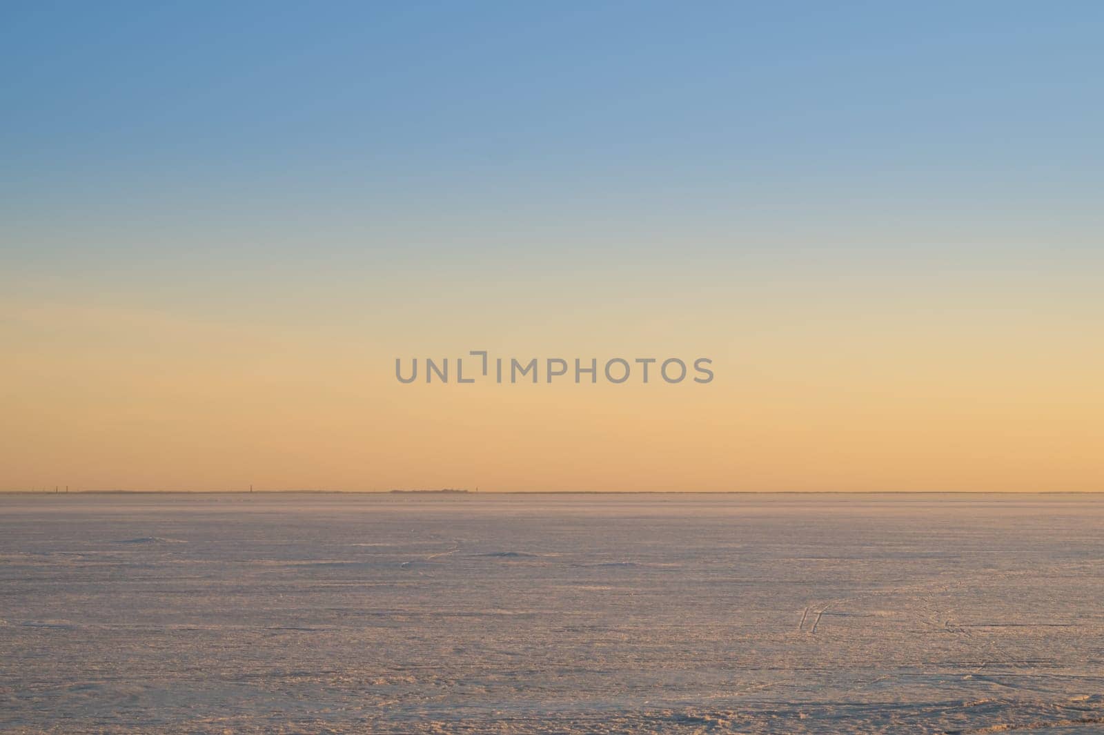 Frozen lake at sunset landscape background. horizon line