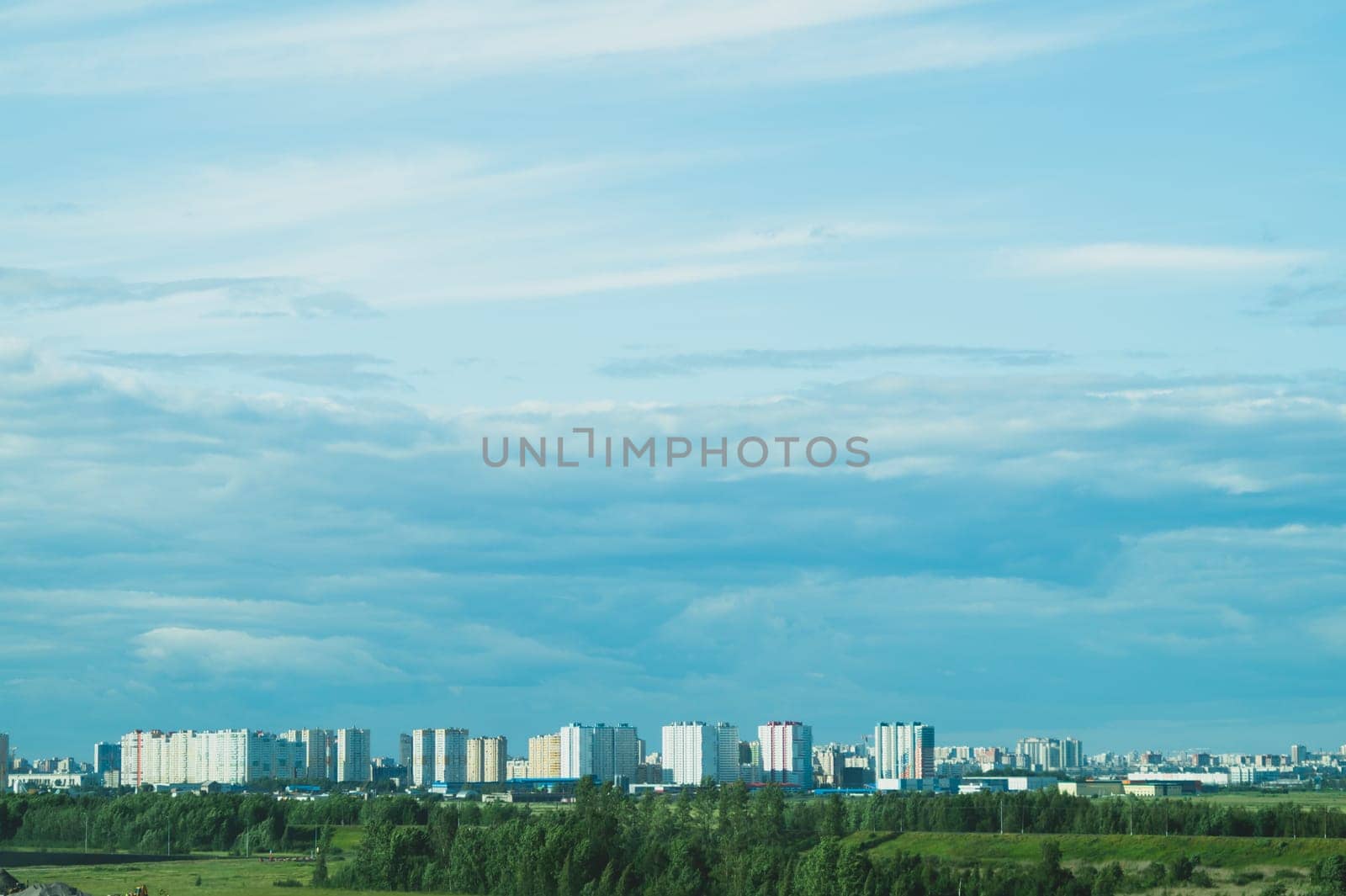Urban cityscape panoramic view. horizon line with buildings. nature landscape with town and forest. blue sky. city into a distance