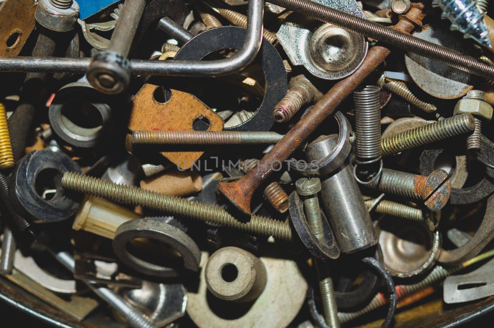 Old screws background. heap of tapping screws. work tool. pile of fasteners. bolts and nuts. metal scrap