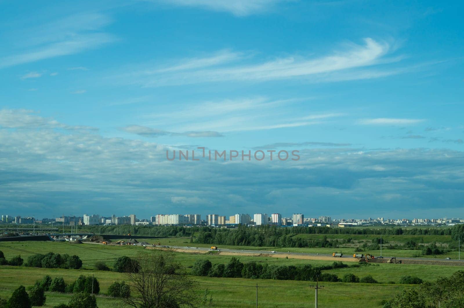 Urban cityscape panoramic view. horizon line with buildings. nature landscape with town and forest. blue sky. city into a distance