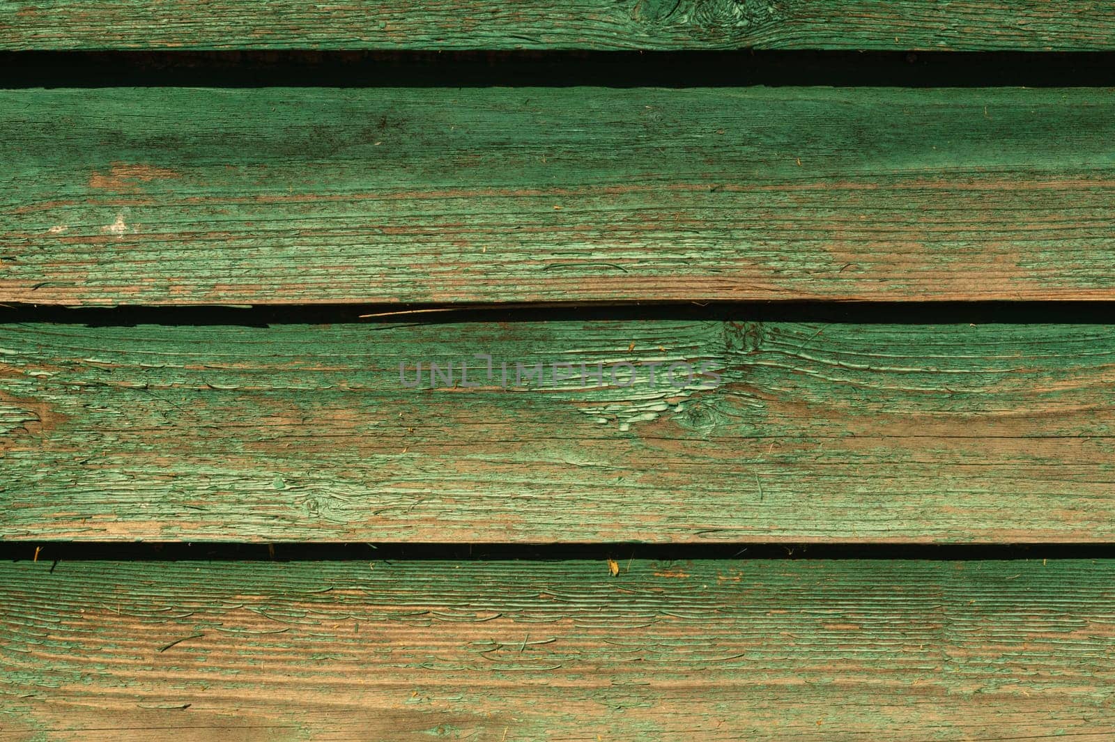 Colored wood texture. green wooden planks. shabby painted wood background