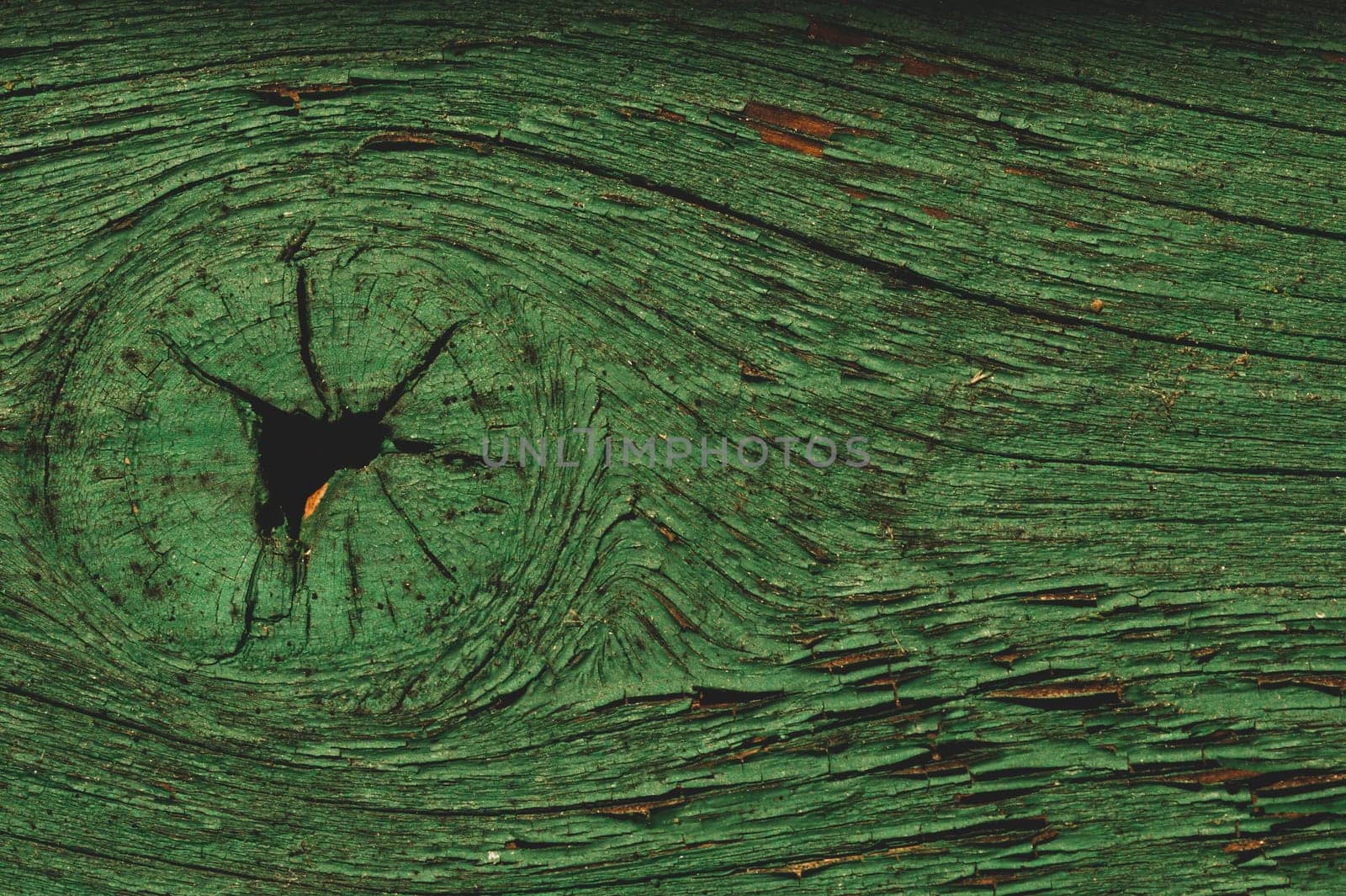 Abstract wood texture with peeling paint. green wooden backdrop. shabby painted wood background