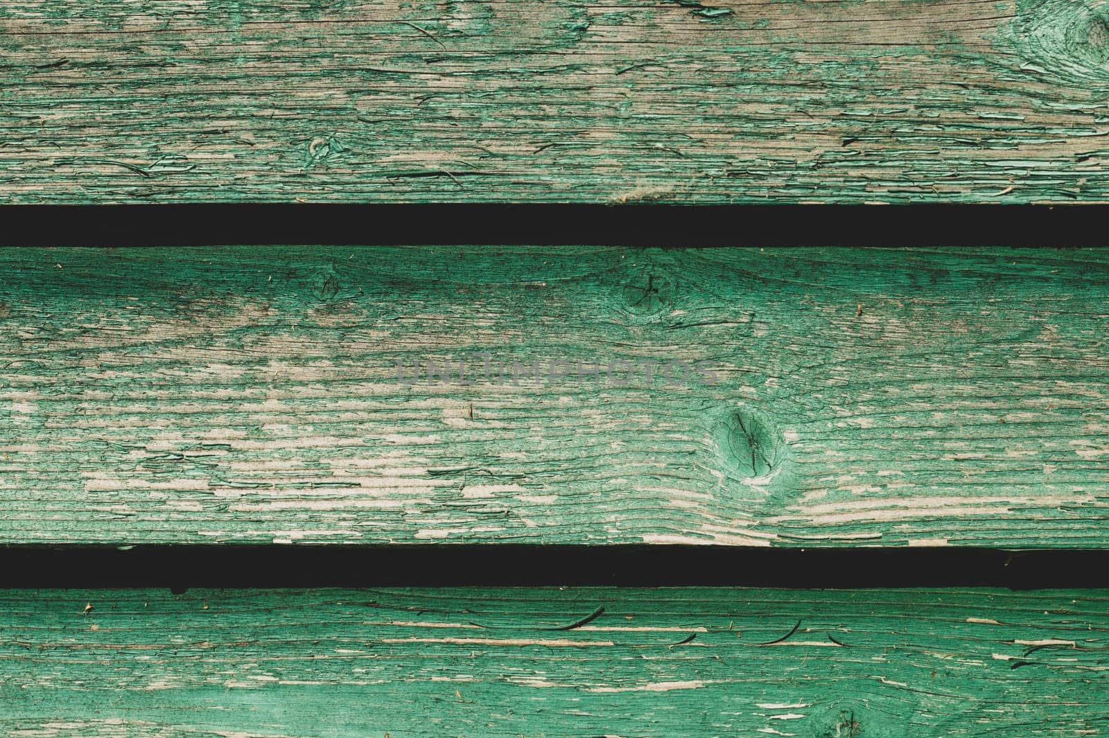 Colored wood texture. green wooden planks. shabby painted wood background