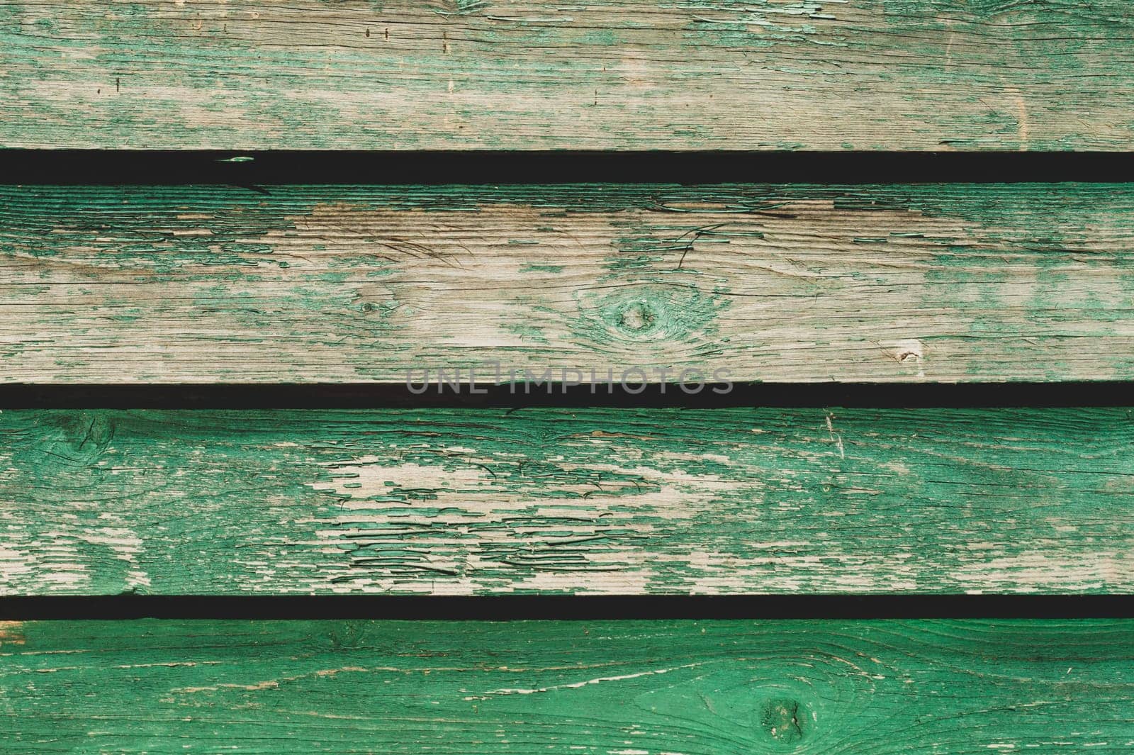Colored wood texture. green wooden planks. shabby painted wood background