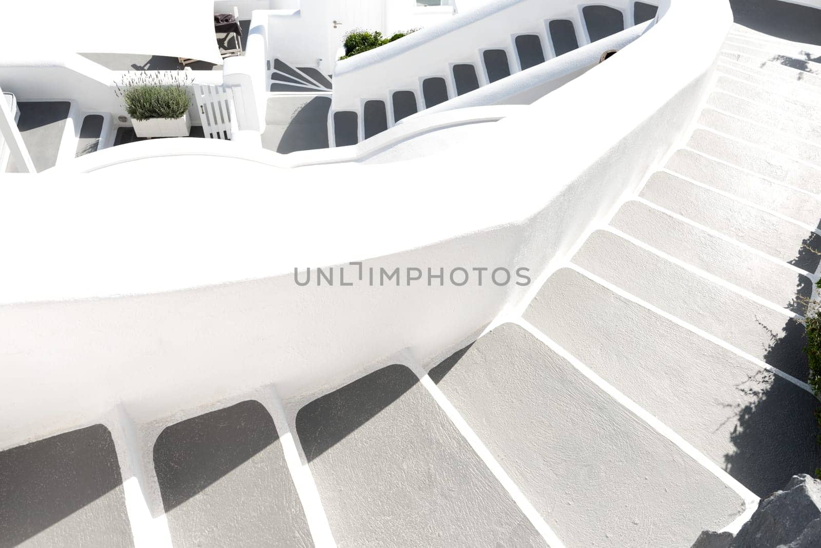Oia town on Santorini island, Greece. Traditional and famous houses and churches with blue domes over the Caldera, Aegean sea