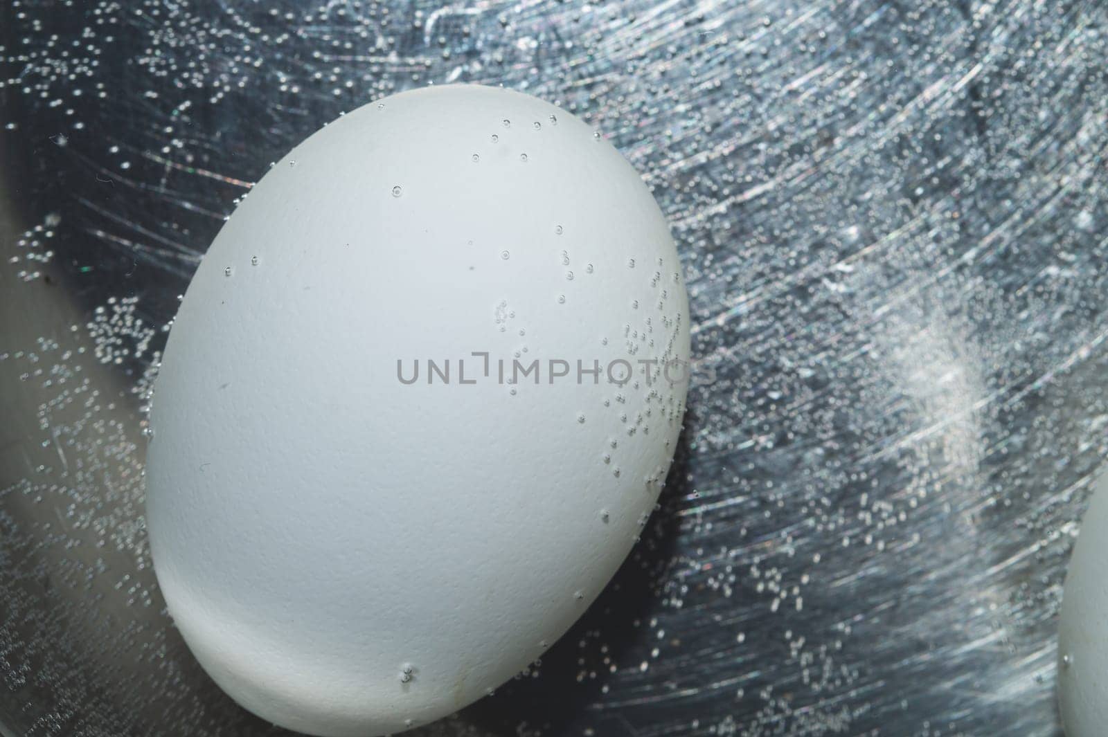 Egg boiled in a pot with hot water