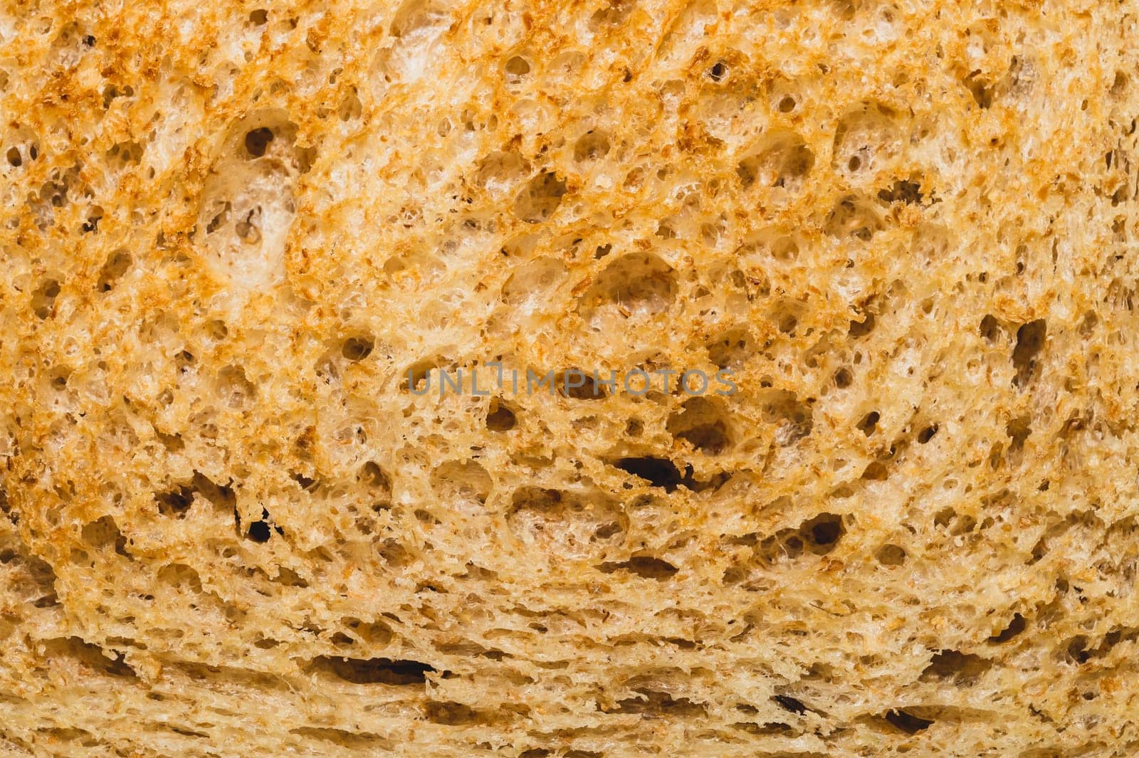 Sliced bread texture. piece of wheat bread close up
