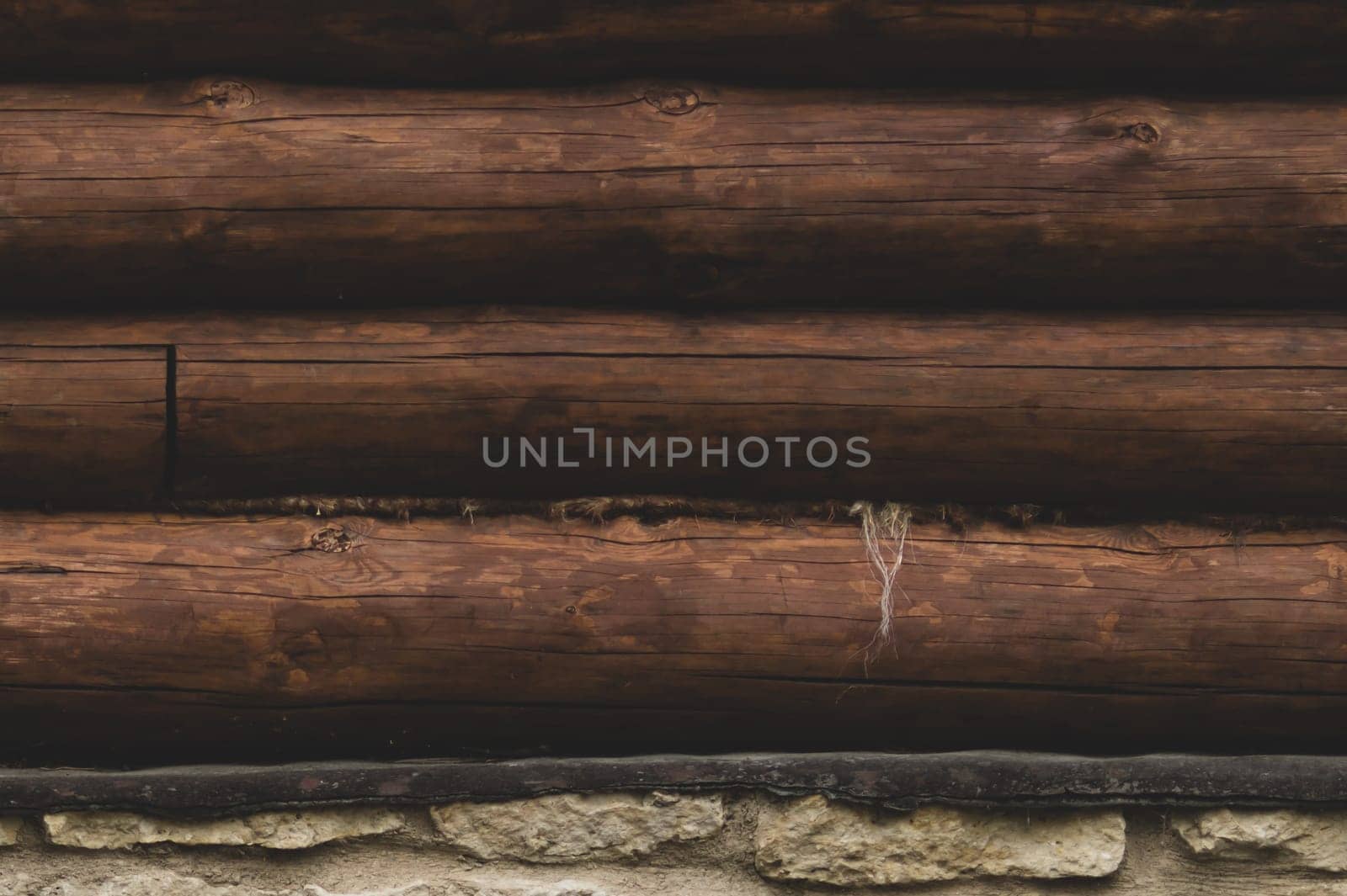 Wall of logs. wood background. rural house exterior