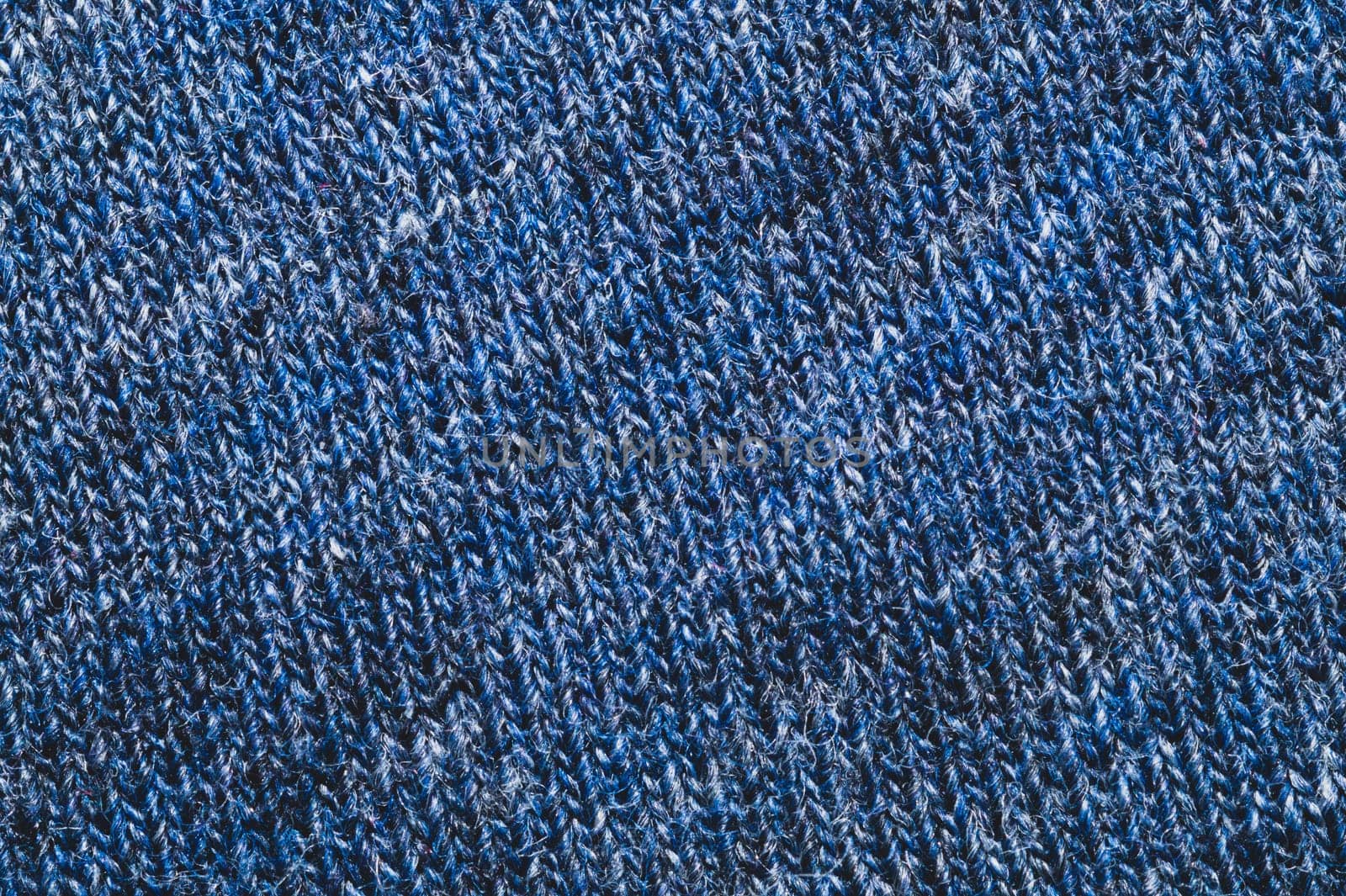 Fabric texture. woolen textile. knitted material close up. woven background