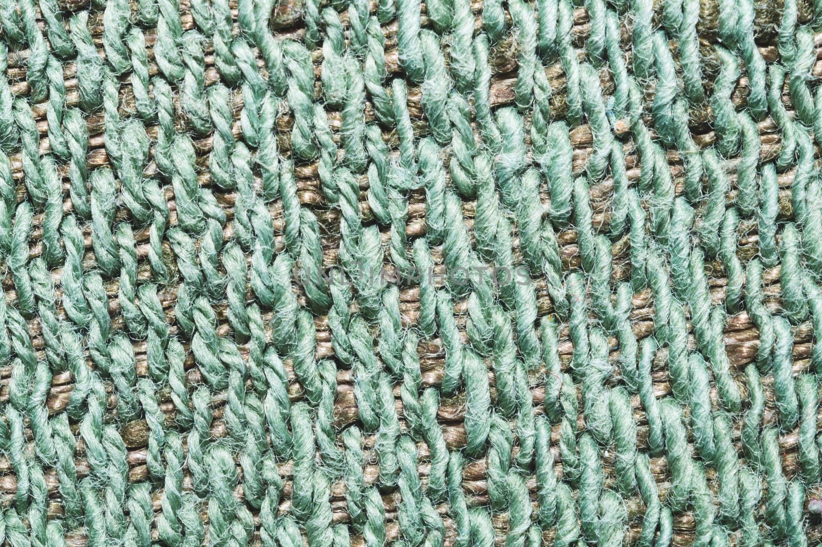 Fabric macro texture. knitted material close up. woven background. woolen textile