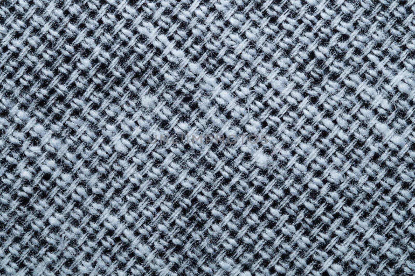 Fabric macro texture. knitted textile close up. woven background. woolen material