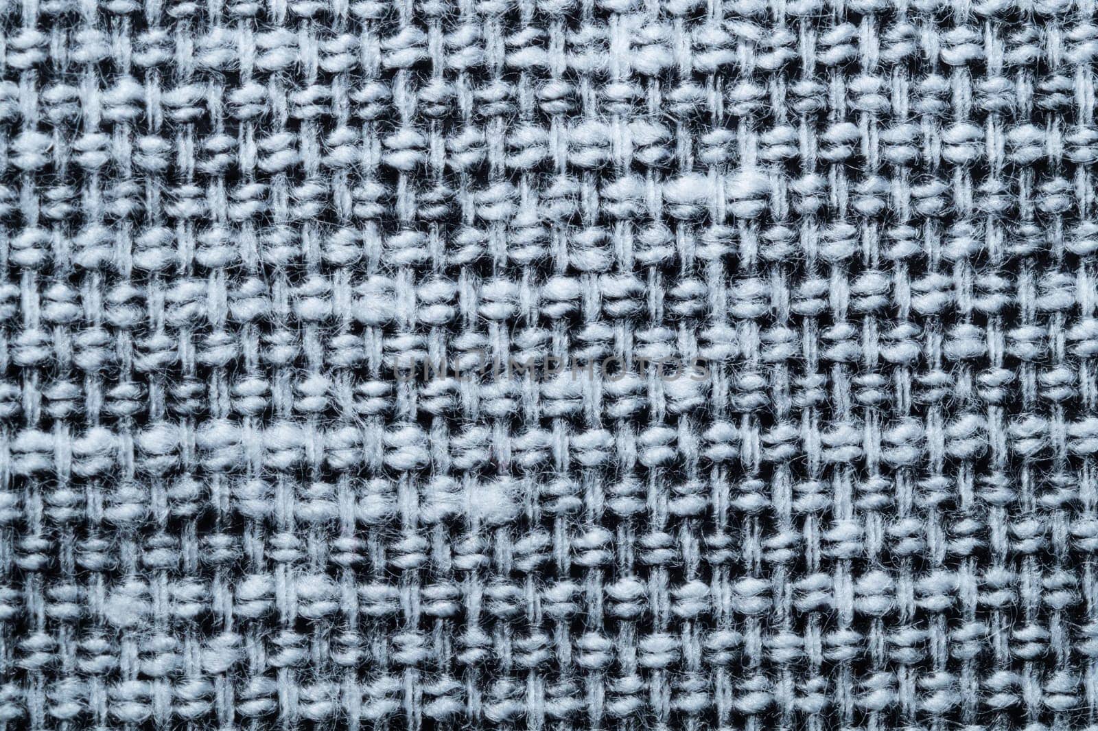 Fabric macro texture. knitted textile close up. woven background. woolen material