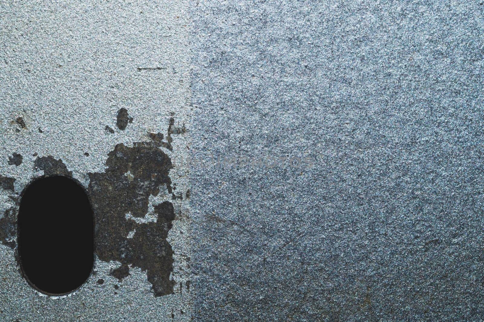 Iron plate macro. metal sheet with hole. steel background close up