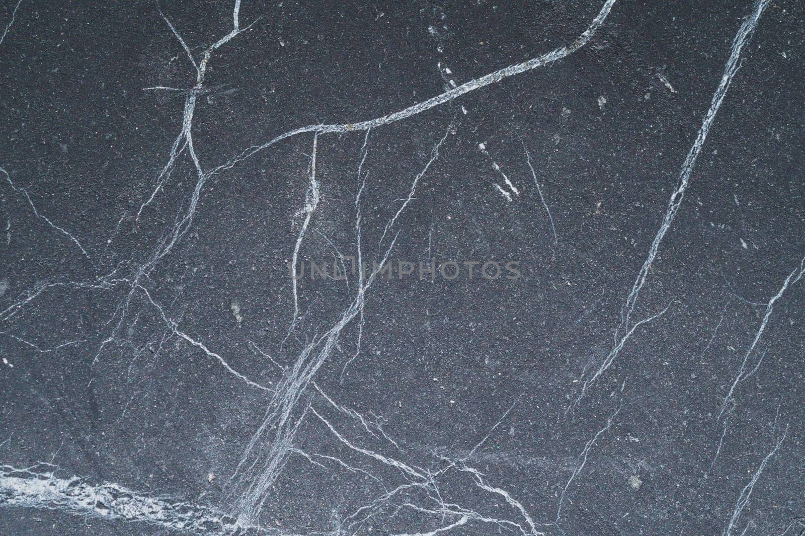 Carbon stone gray texture. flat scratched surface. geological background