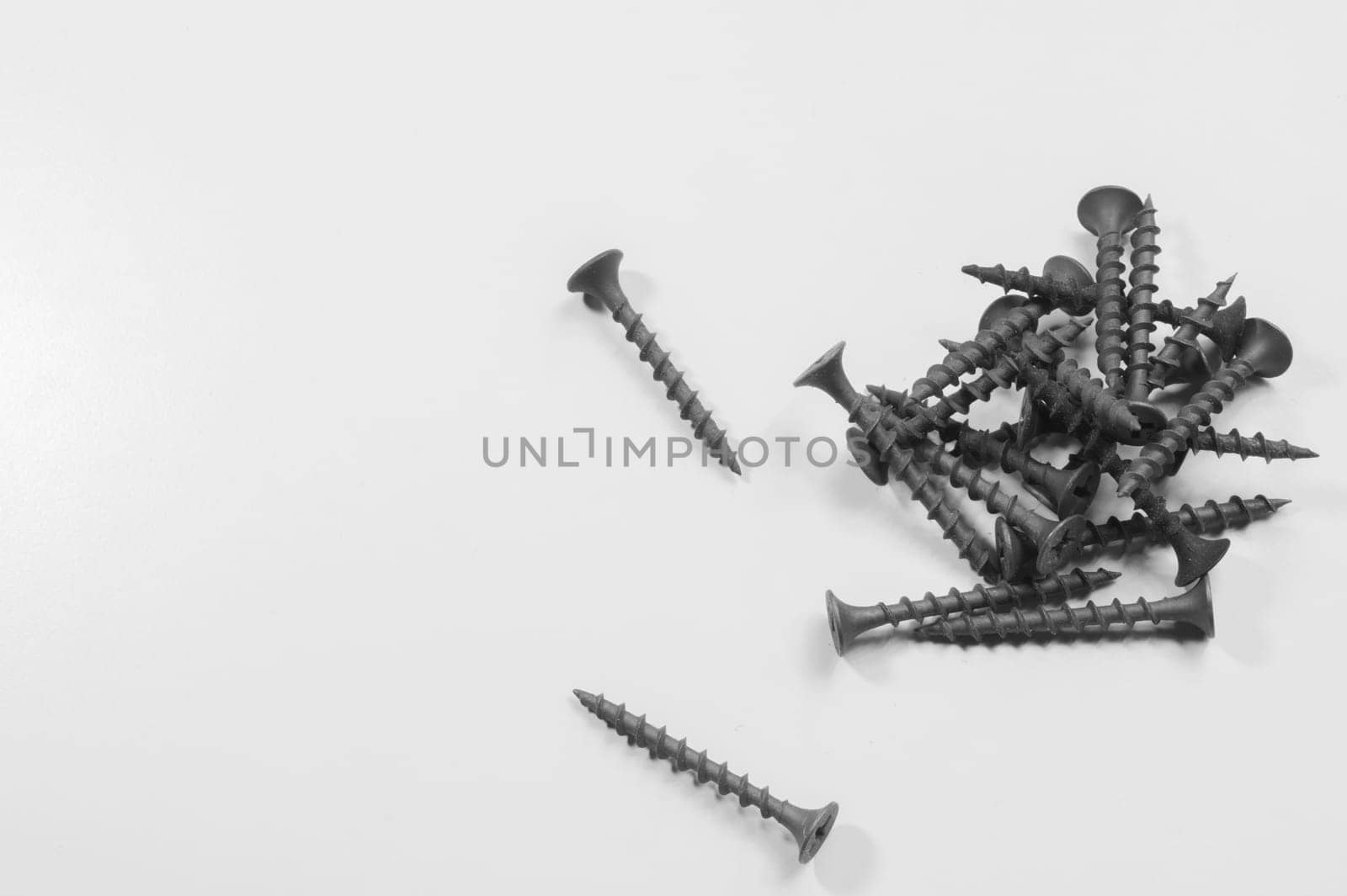 Steel screw on a white background. working tools