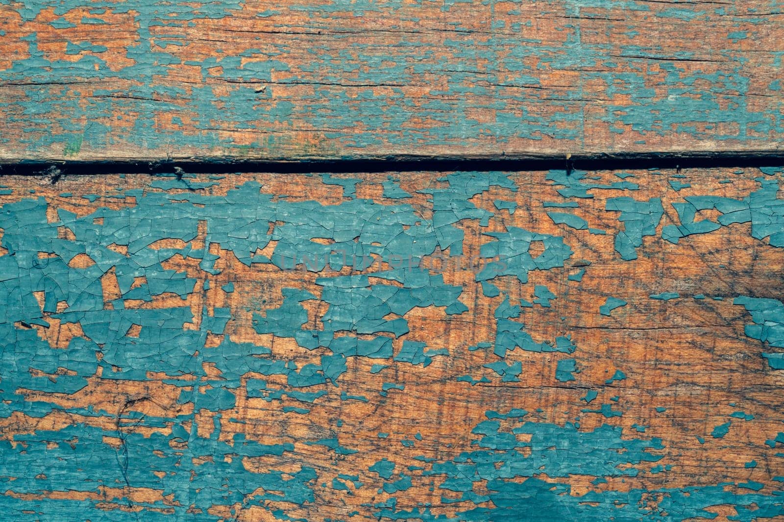Wooden texture with cracked paint. shabby wood background close up