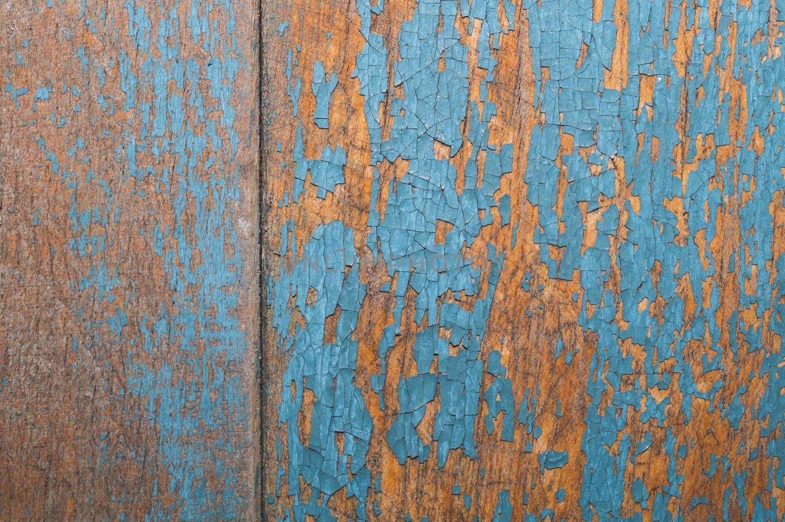 Wooden texture with cracked paint. shabby wood background close up