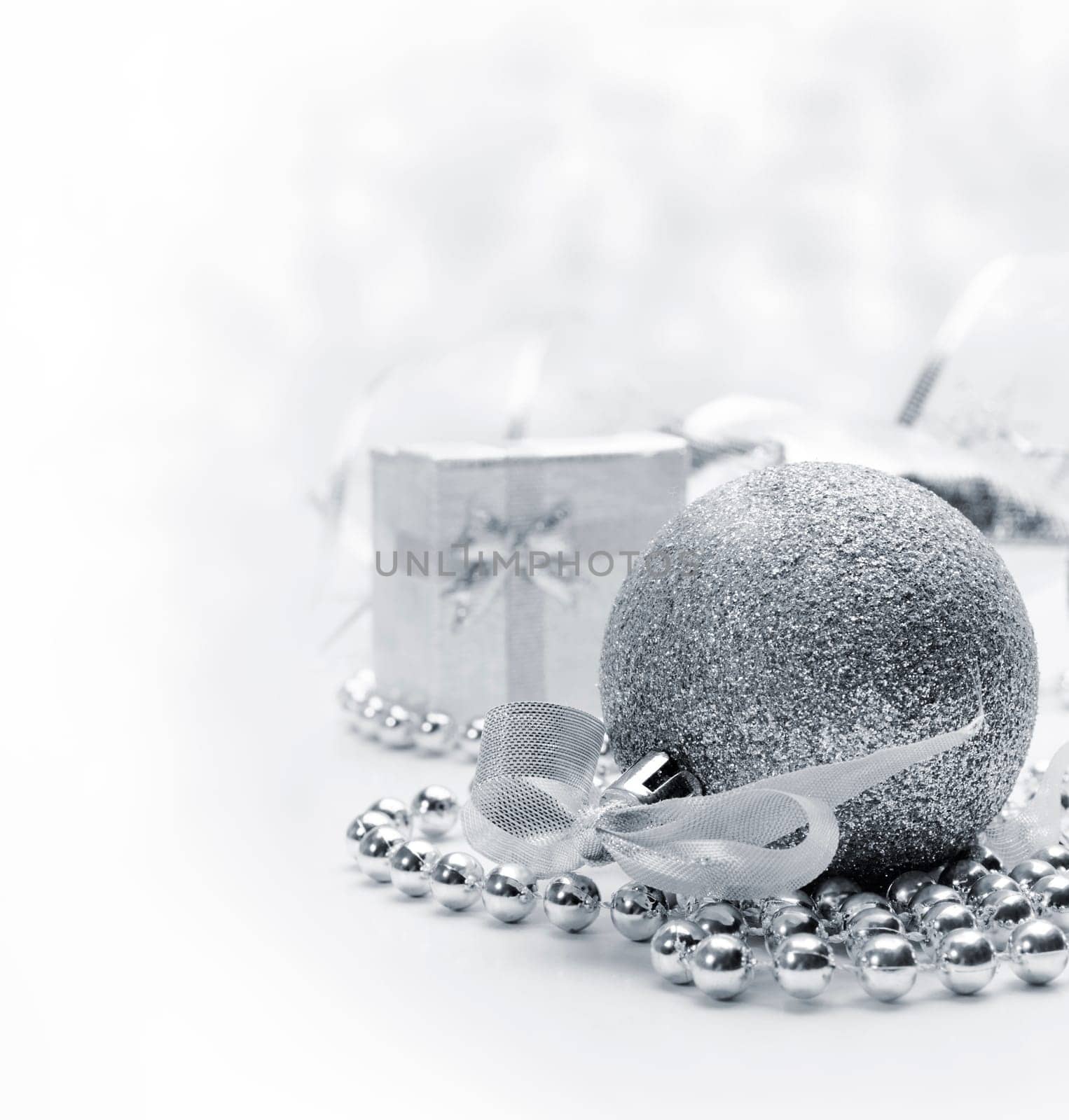 Silver christmas ornaments with bokeh background
