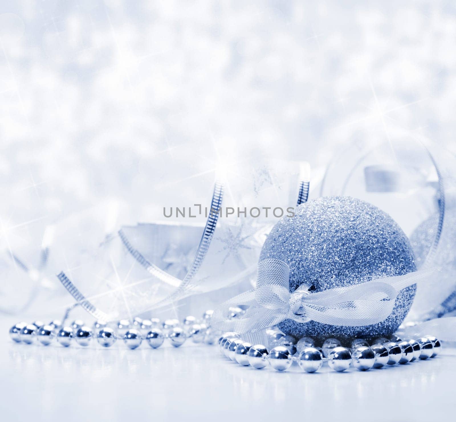 Silver christmas ornaments with bokeh background