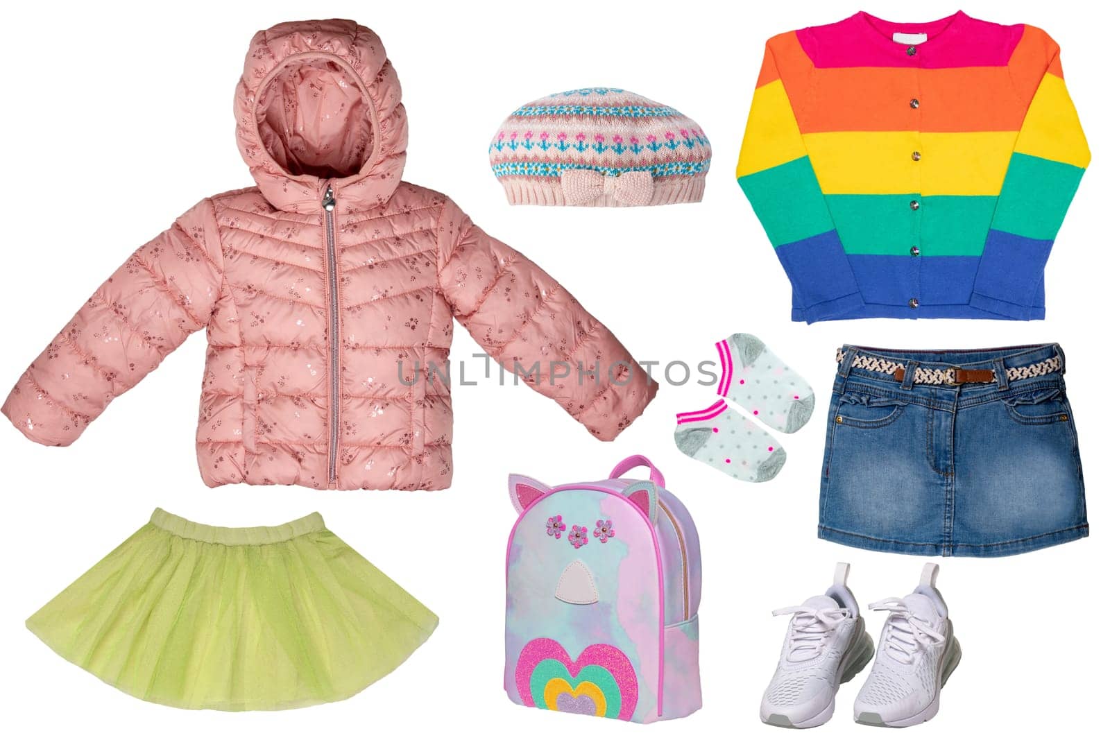 Collage set of little girl spring clothing isolated on a white background. The collection of a stylish pink down jacket, a sweater, a jeans skirt, sneaker, a bag and a skirt. Kids autumn and winter fashion.