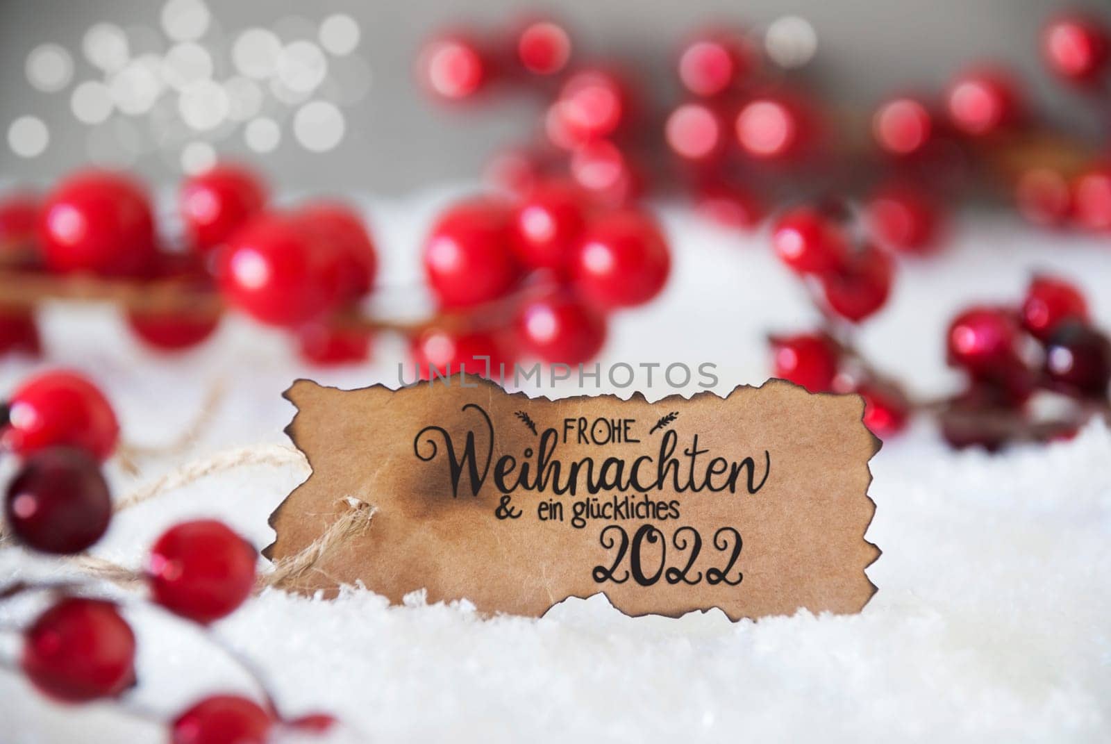 Burnt Label With German Calligraphy Frohe Weihnachten Und Ein Glueckliches 2022 Means Merry Christmas And A Happy 2022. Red Christmas Decoration With Snow And Snowflakes