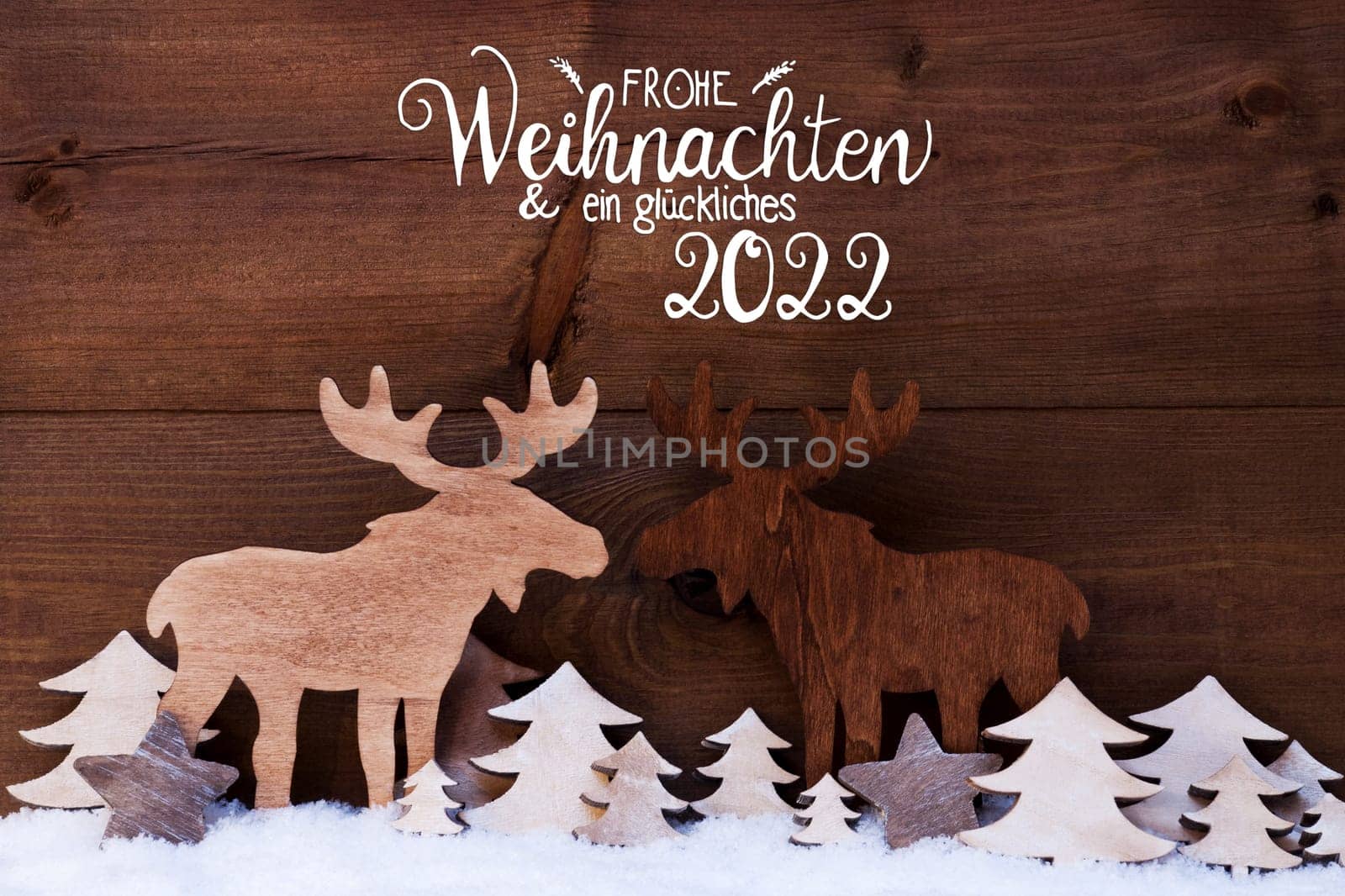 German Calligraphy Frohe Weihnachten Und Ein Glueckliches 2022 Means Merry Christmas And Happy 2022. White Wooden Tree And Moose On Snow WIth Wooden Background